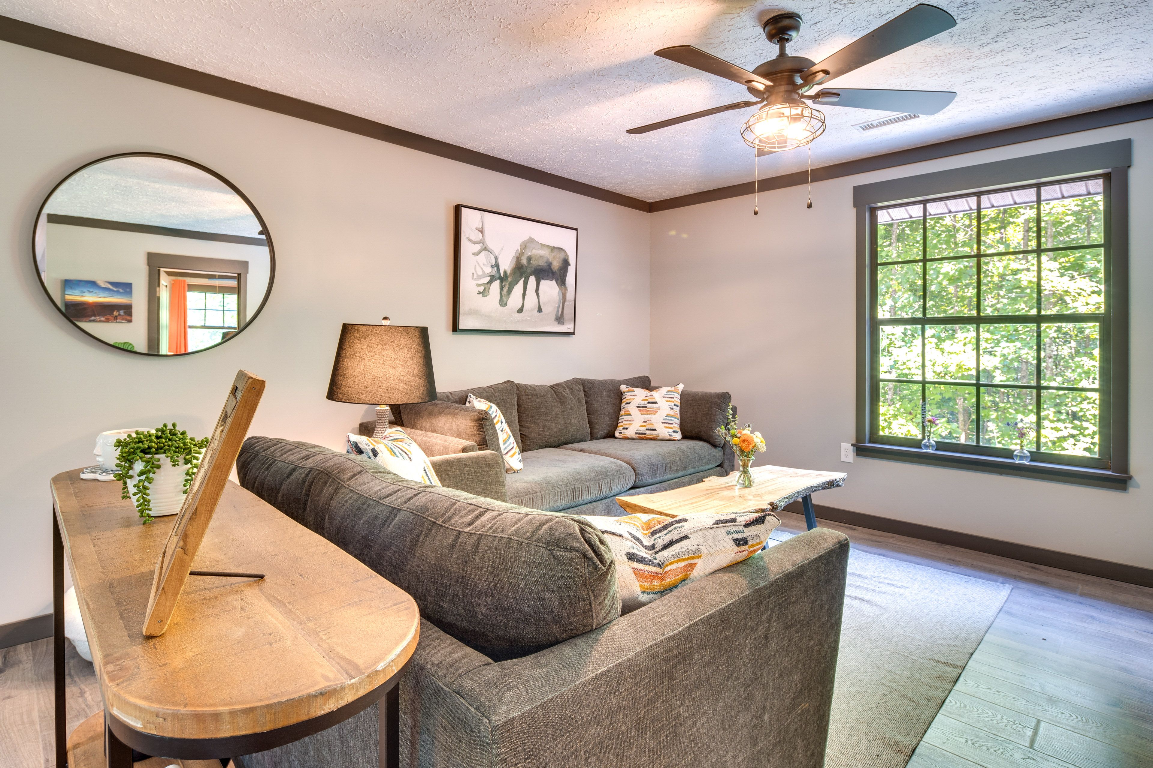 Living Room | Smart TV | Electric Fireplace | Queen Sleeper Sofa | Free WiFi