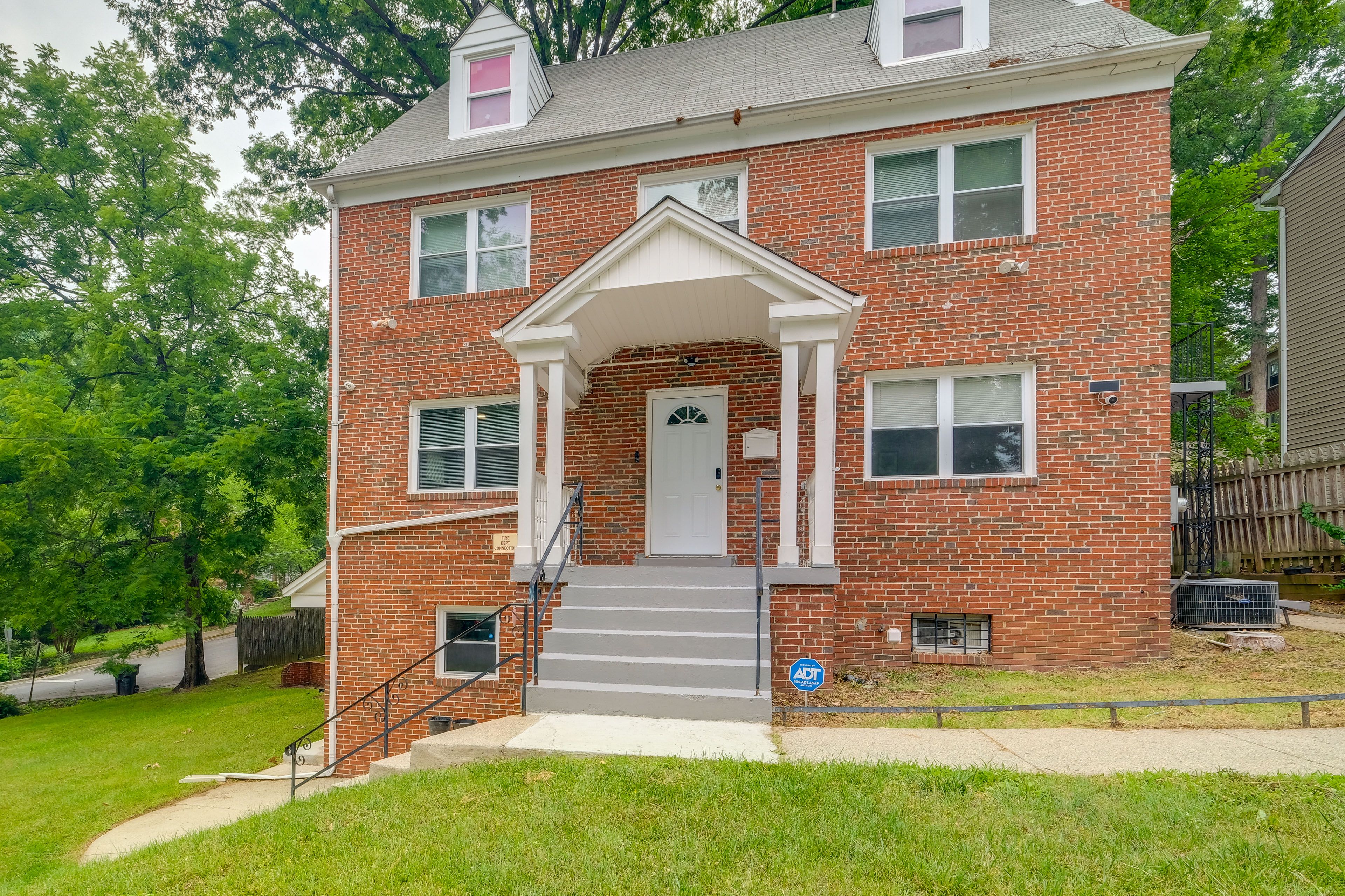 Property Exterior | 1st-Floor Unit | Driveway (2 Vehicles) | Free Street Parking
