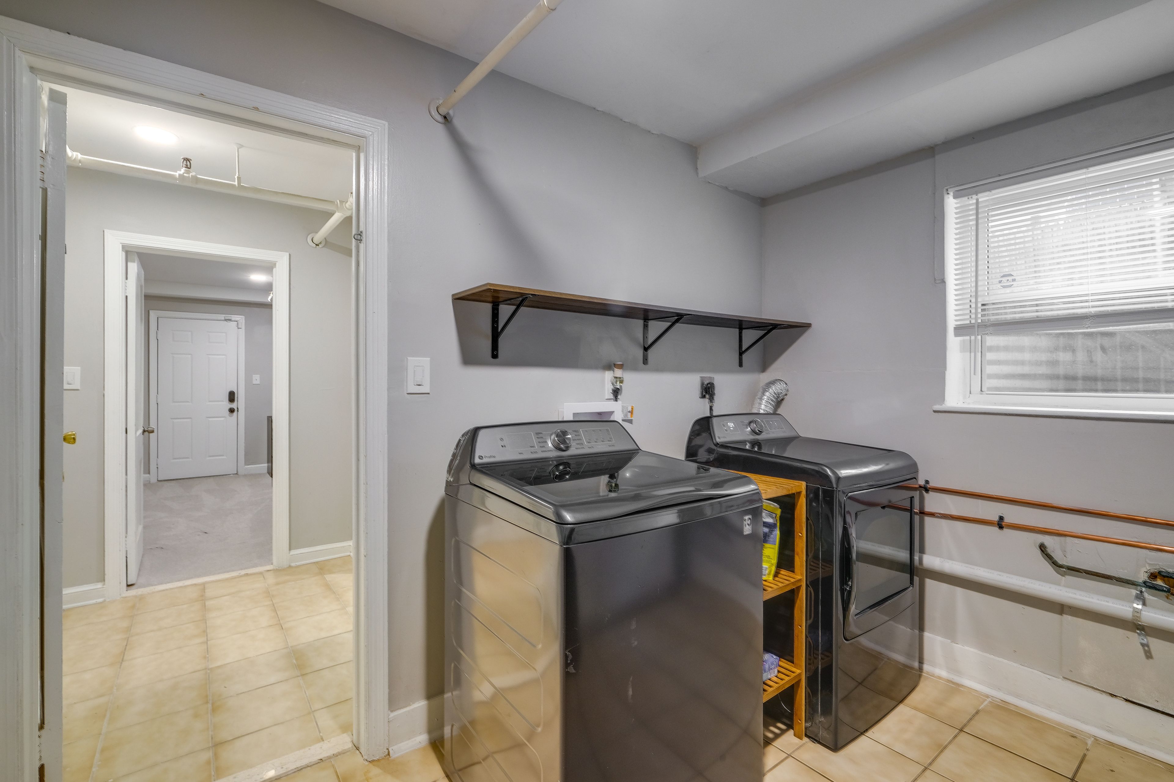 In-Unit Laundry | Lower-Level Unit | Free WiFi | Radiator Heating