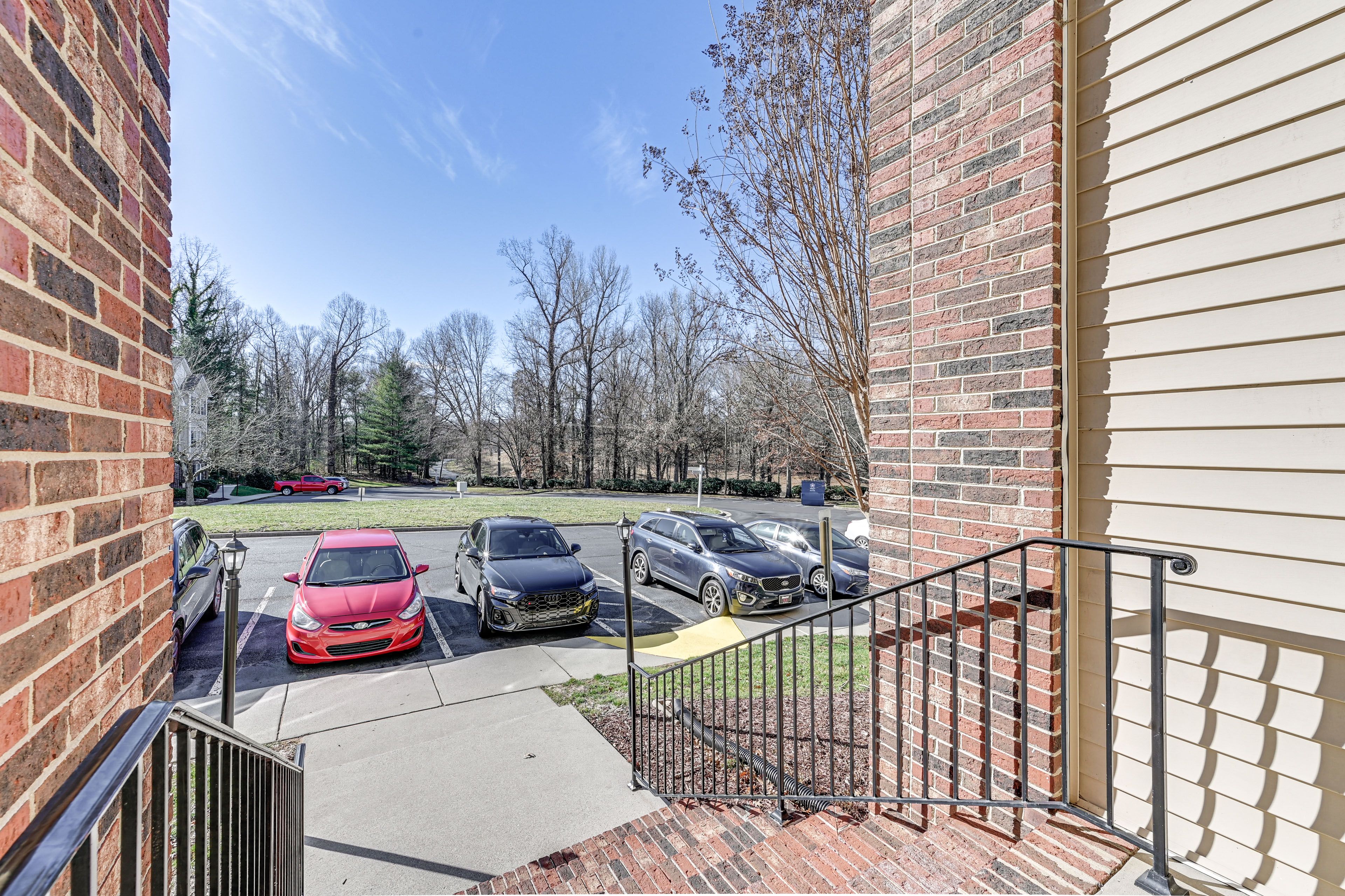 Condo Exterior | Parking | Community Lot (4 Vehicles)