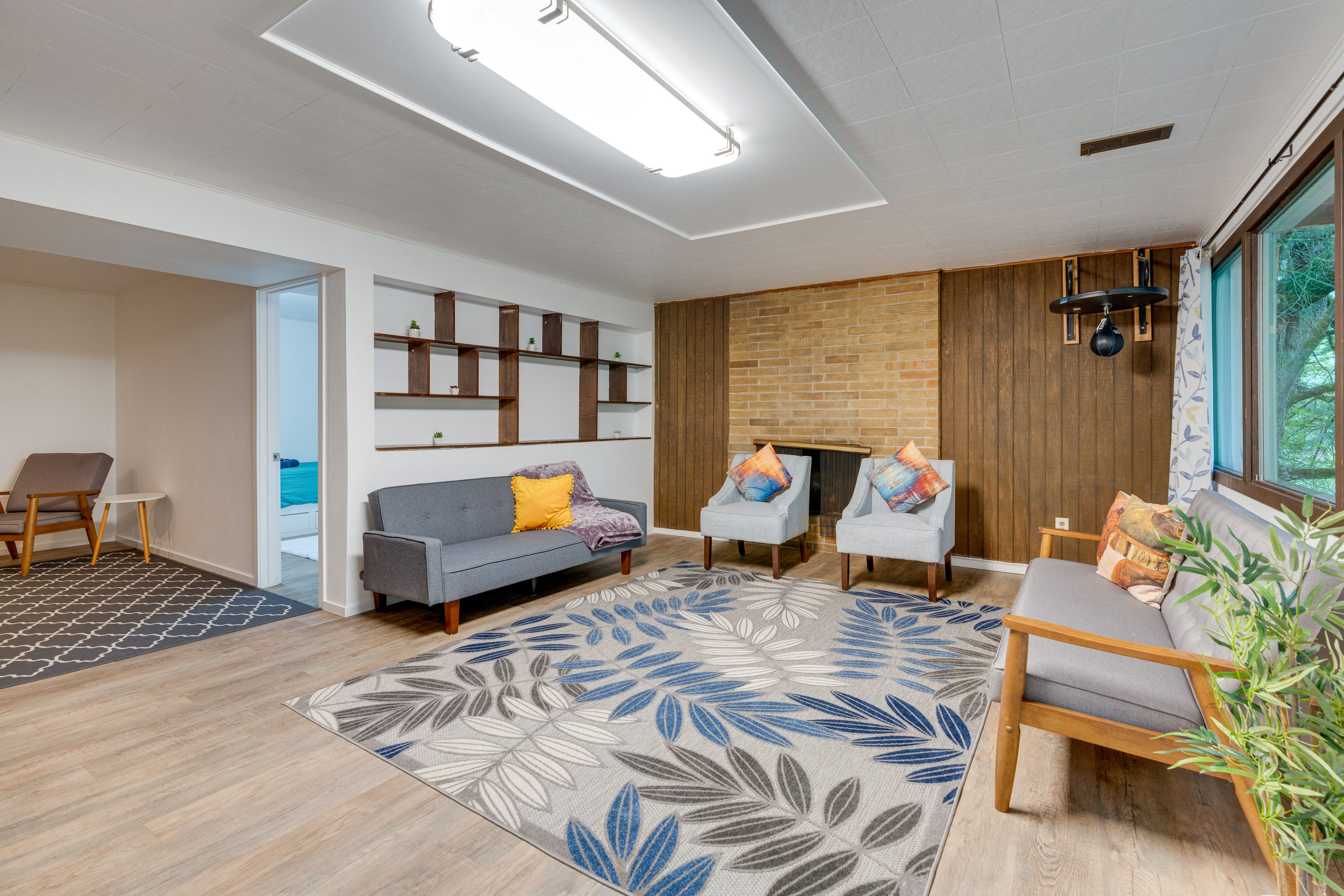 Den | Basement | 2 Futons | Decorative Fireplace