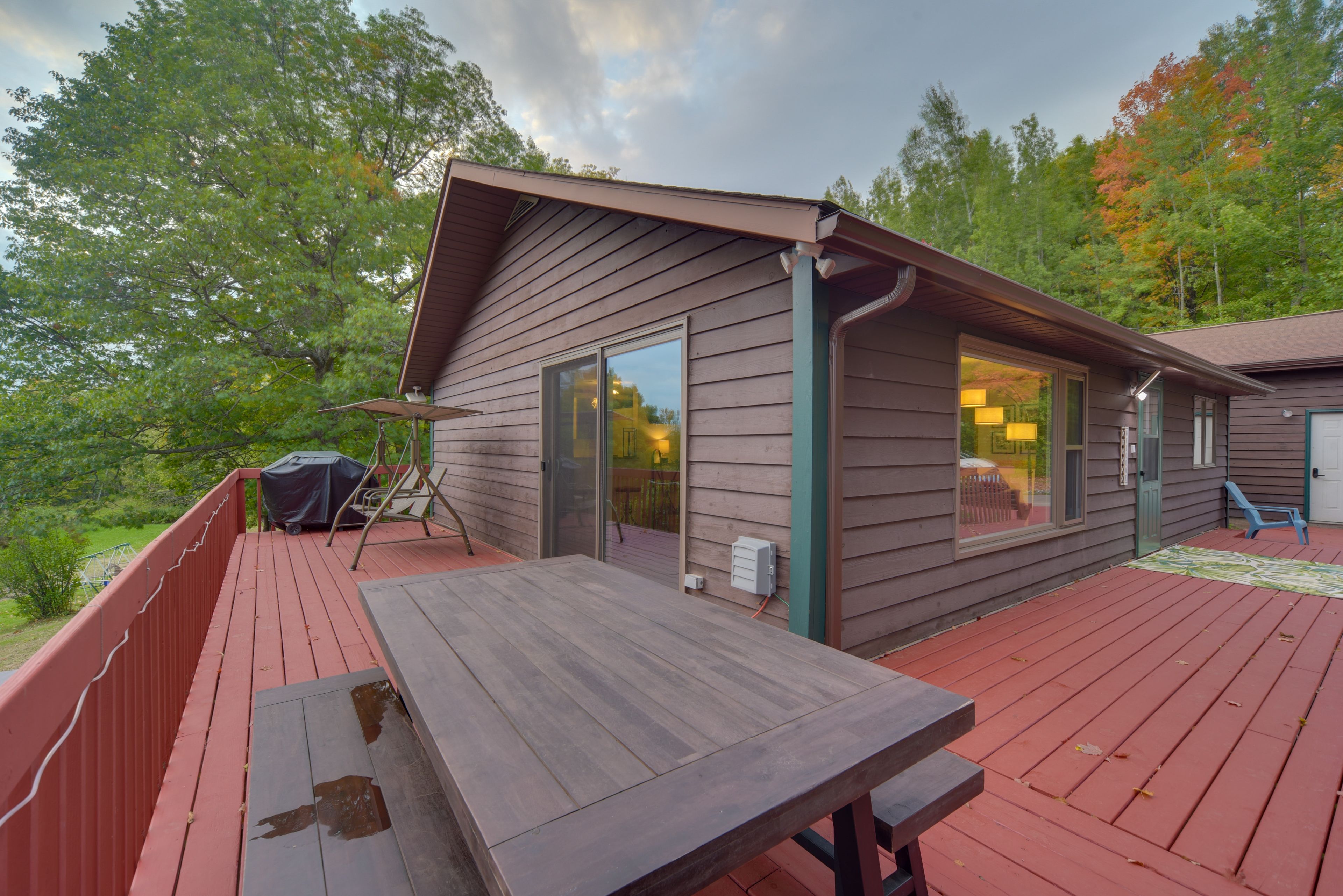 House Exterior | Wraparound Deck | Dining Area | Gas Grill