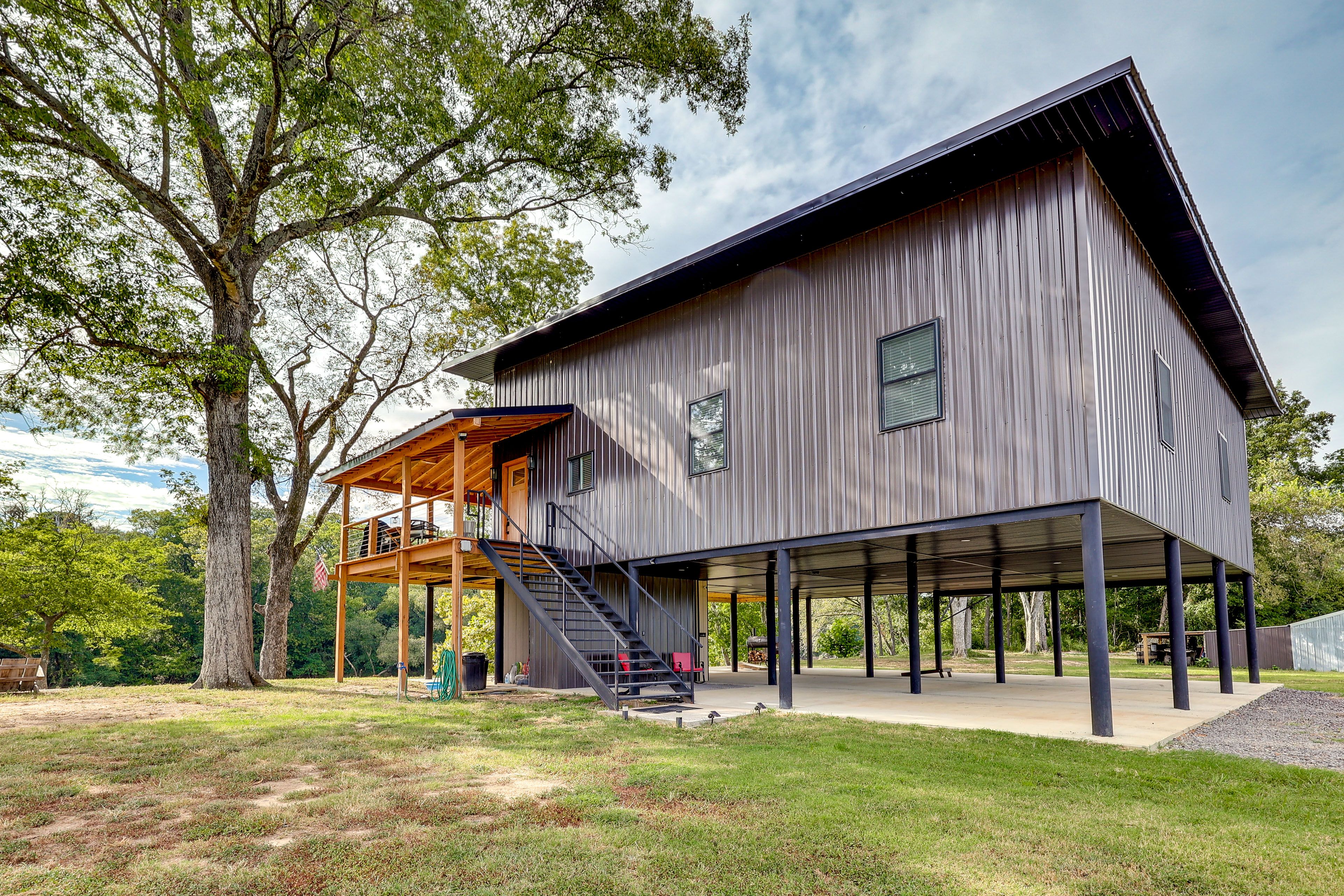 Front Exterior | Raised House | 4 Kayaks