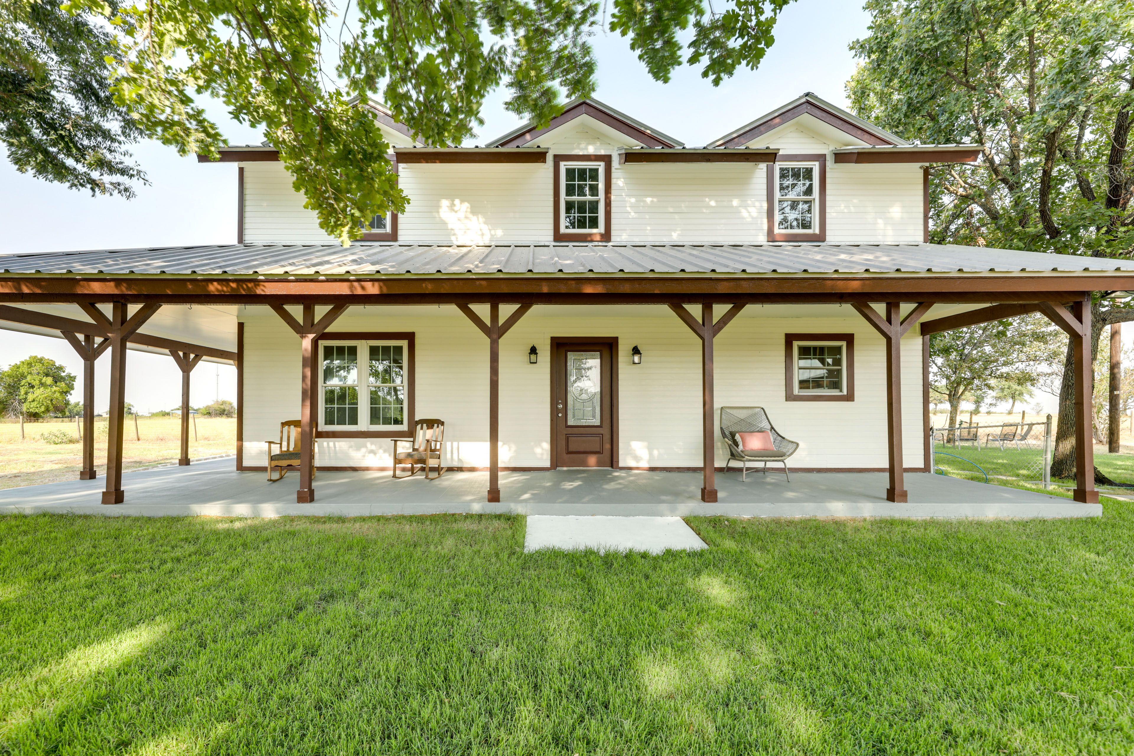 Main Entrance | Wraparound Porch | Rocking Chairs