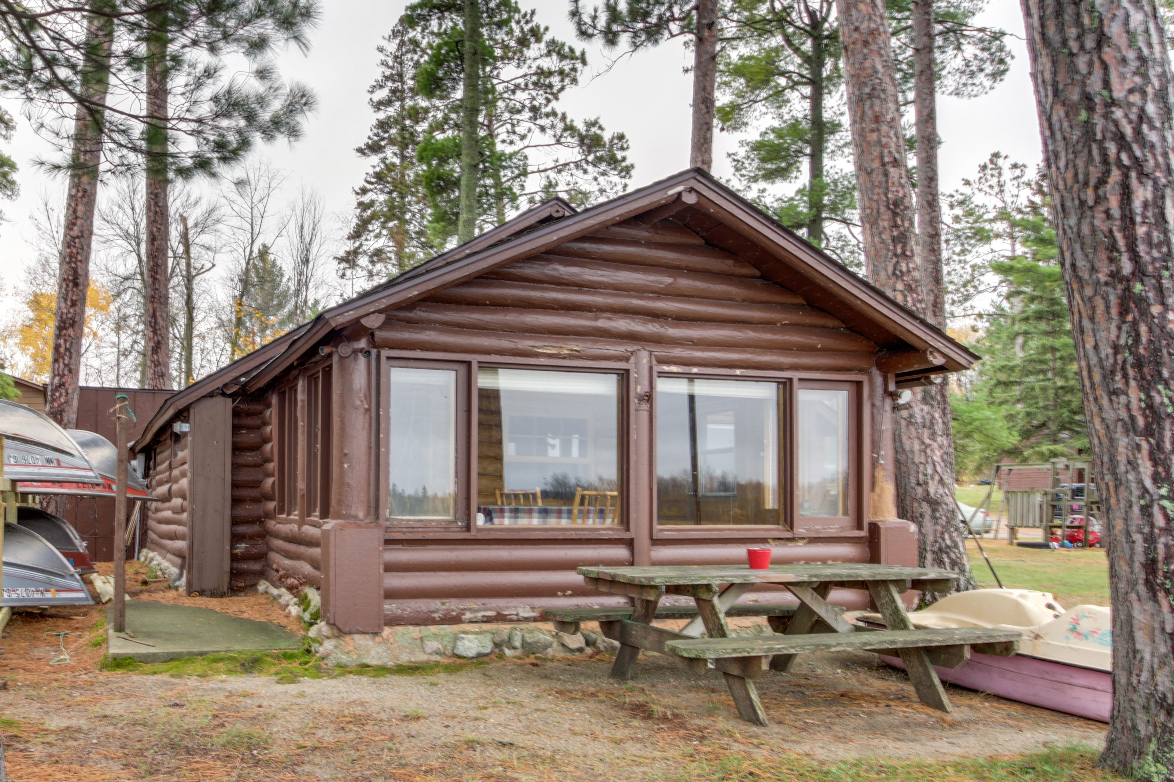 Cabin Exterior | Charcoal Grill | Picnic Table | 14' Aluminum Boat