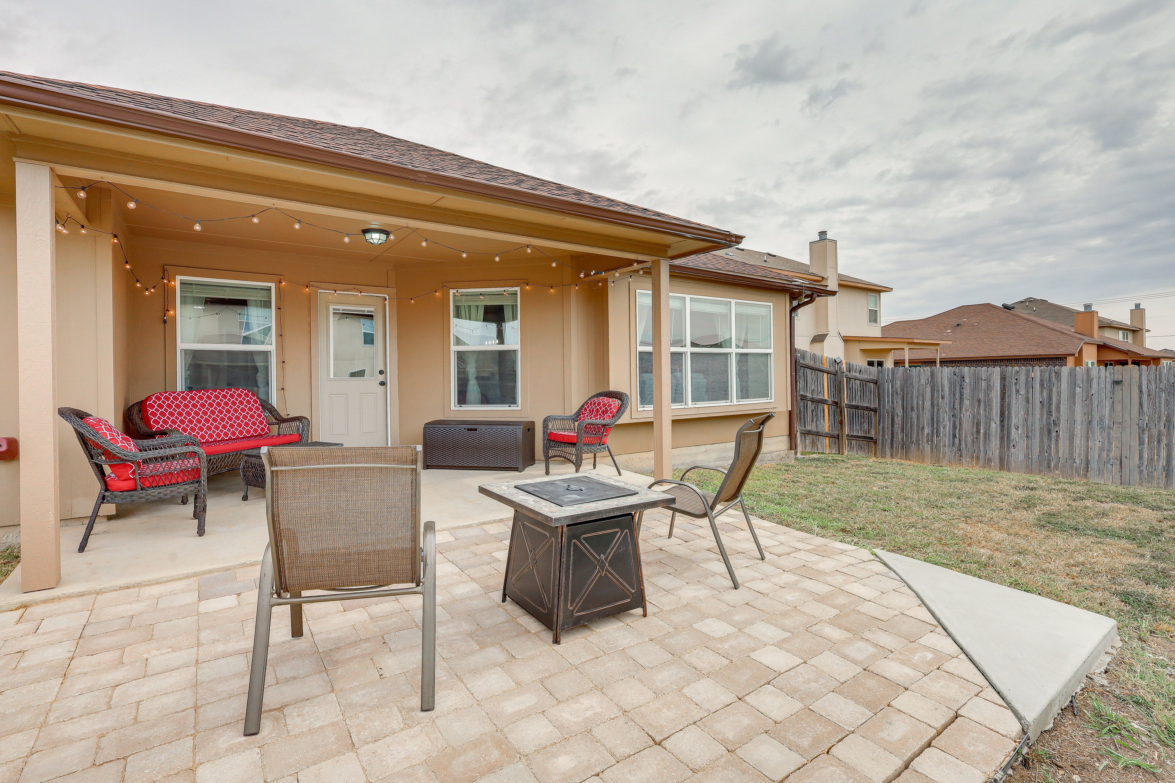 Covered Patio | Gas Fire Pit | Lounge Seating | String Lights