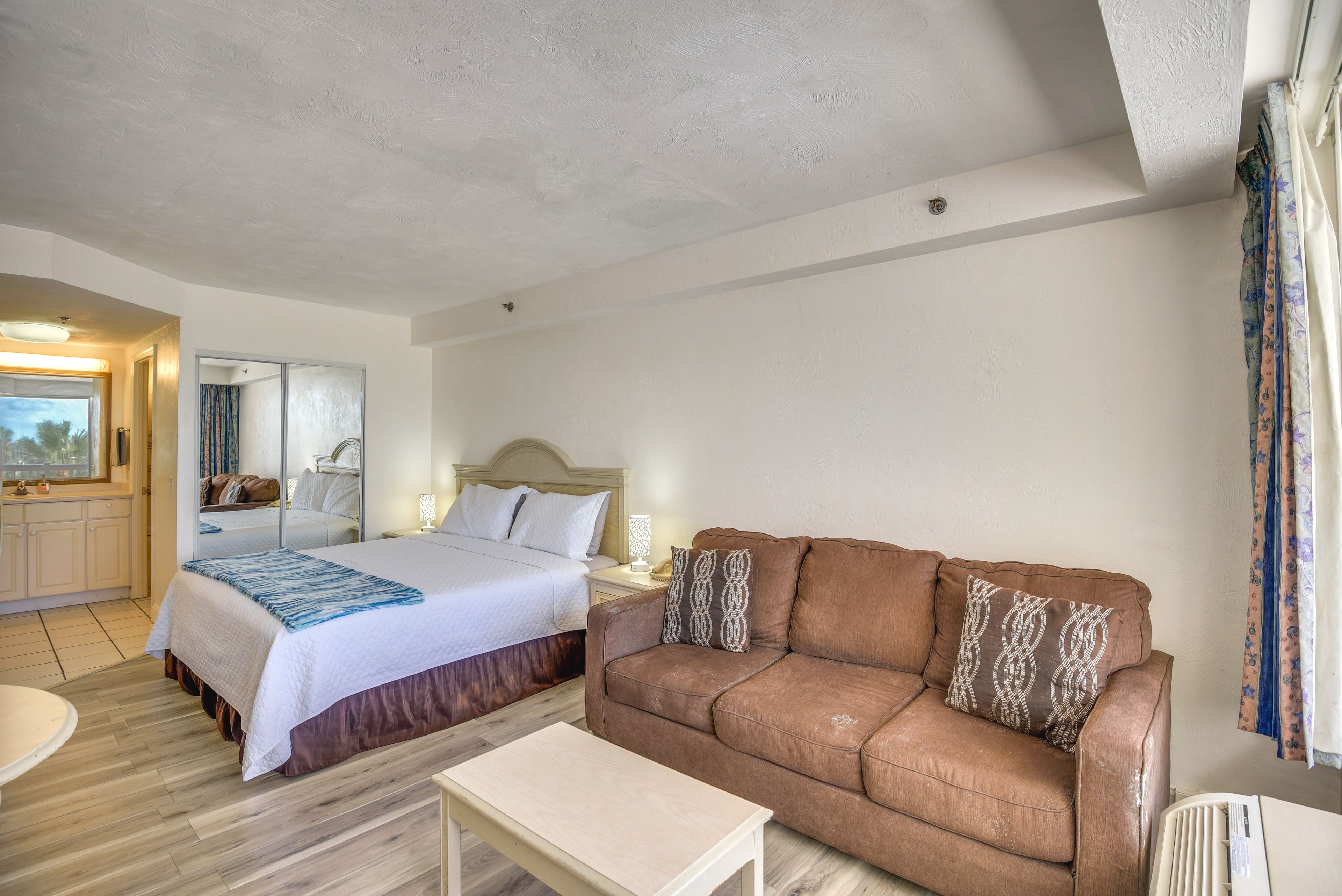 Studio Interior | King Bed | Full Sleeper Sofa | Free WiFi | Window A/C Unit