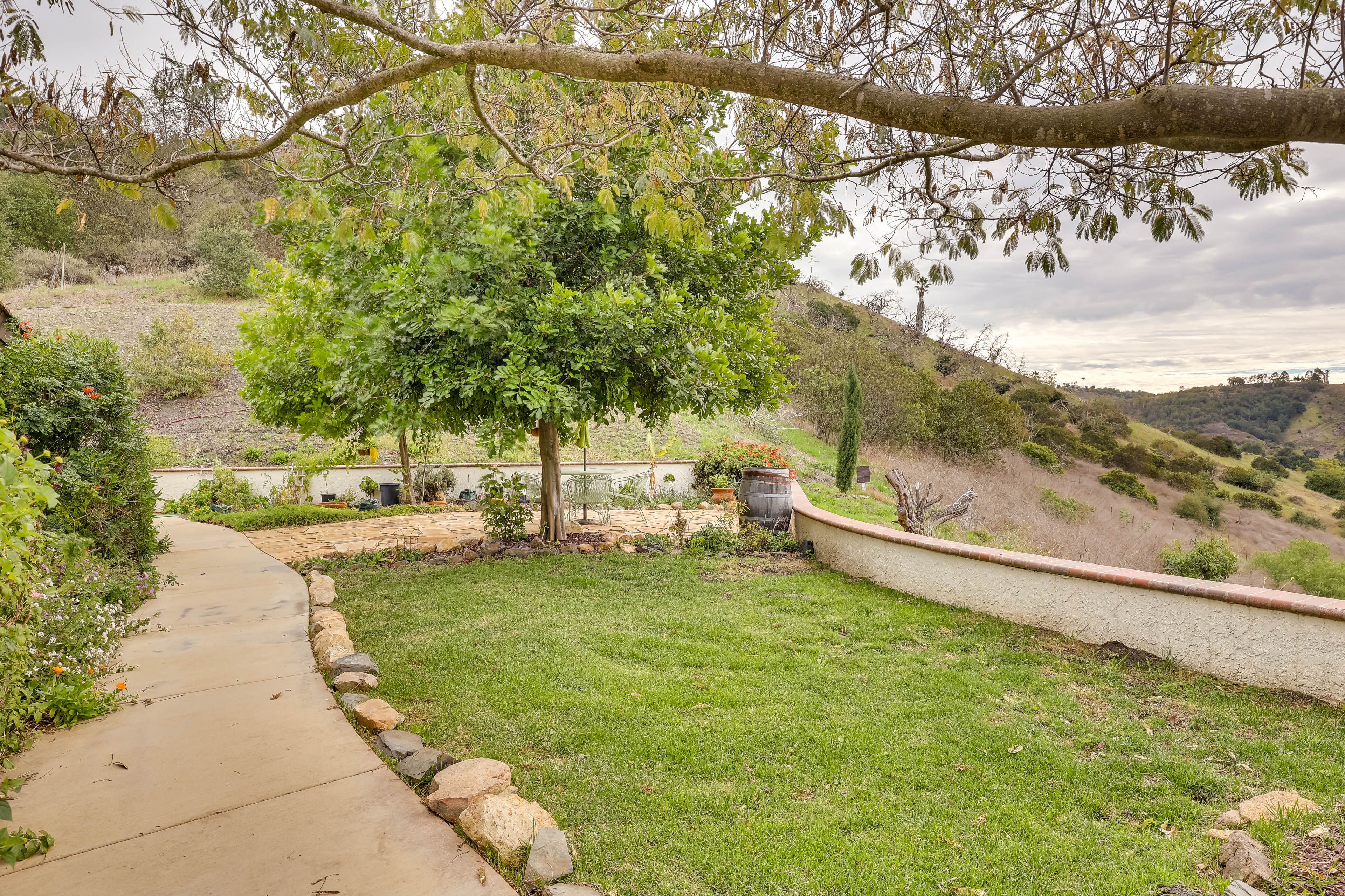House Exterior | Additional Furnished Patio w/ Dining Area