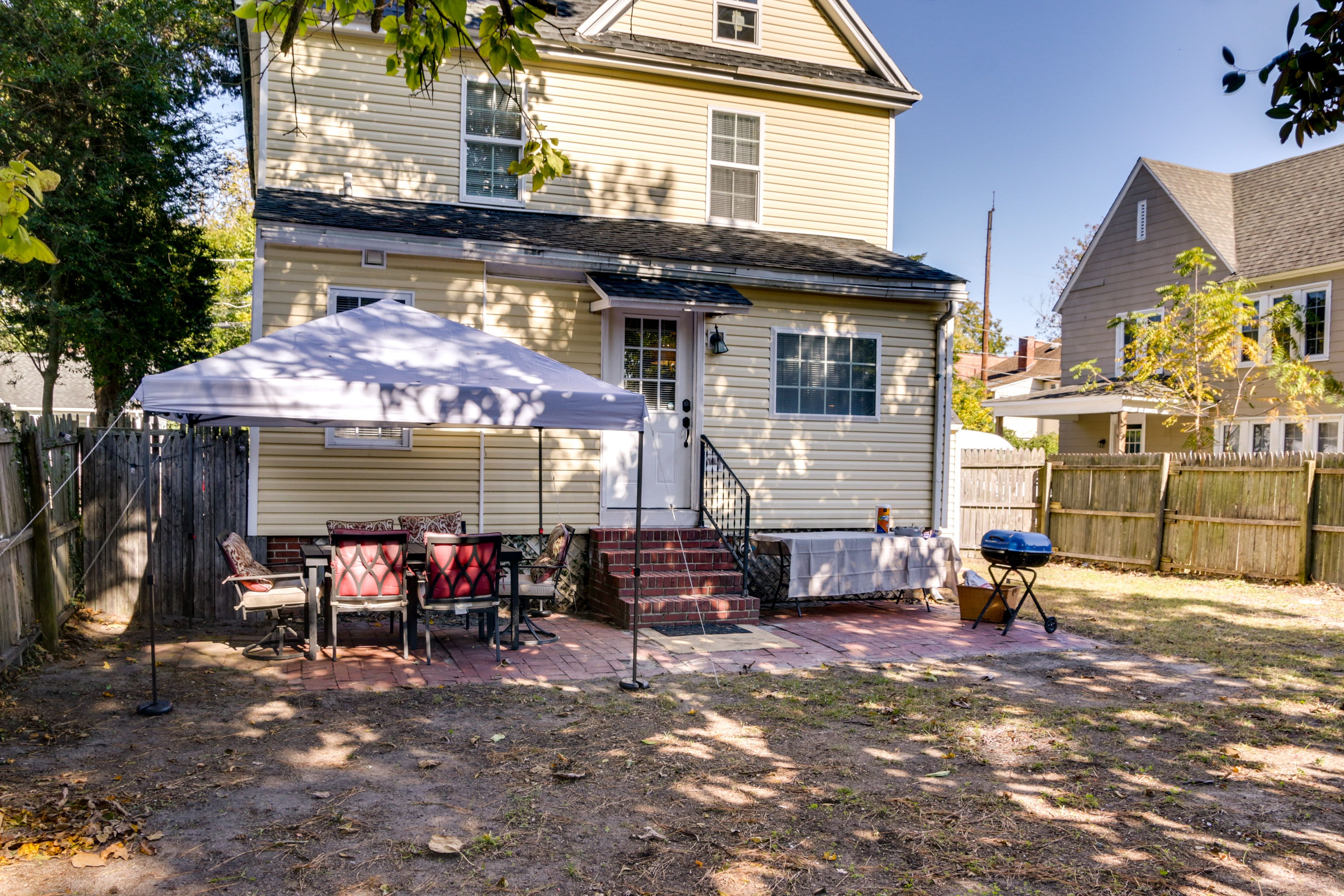 Fenced-In Backyard | Outdoor Dining Area | Charcoal Grill | Fire Pit