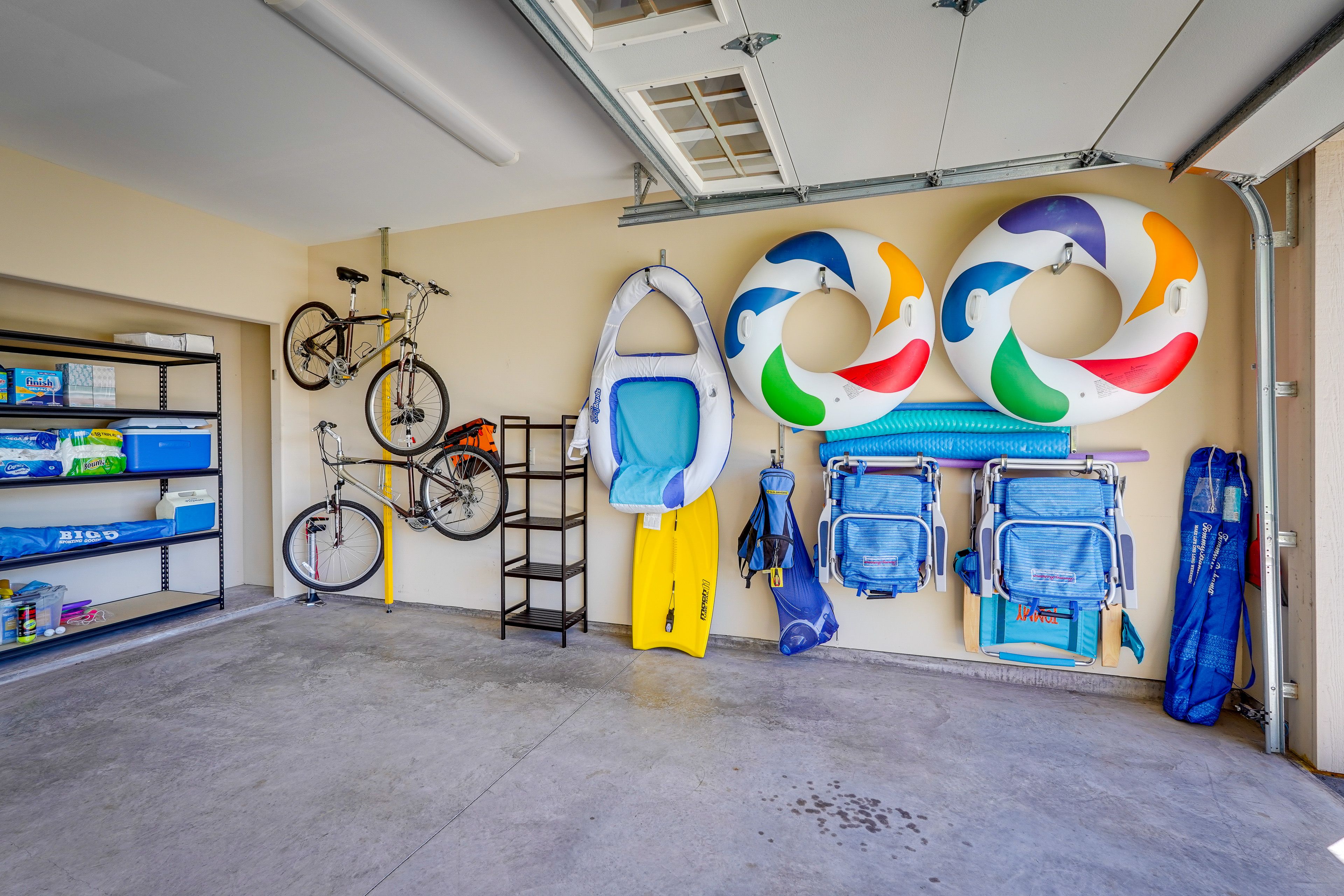 Garage Interior | Pool Floaties | 2 Bicycles | Beach Equipment