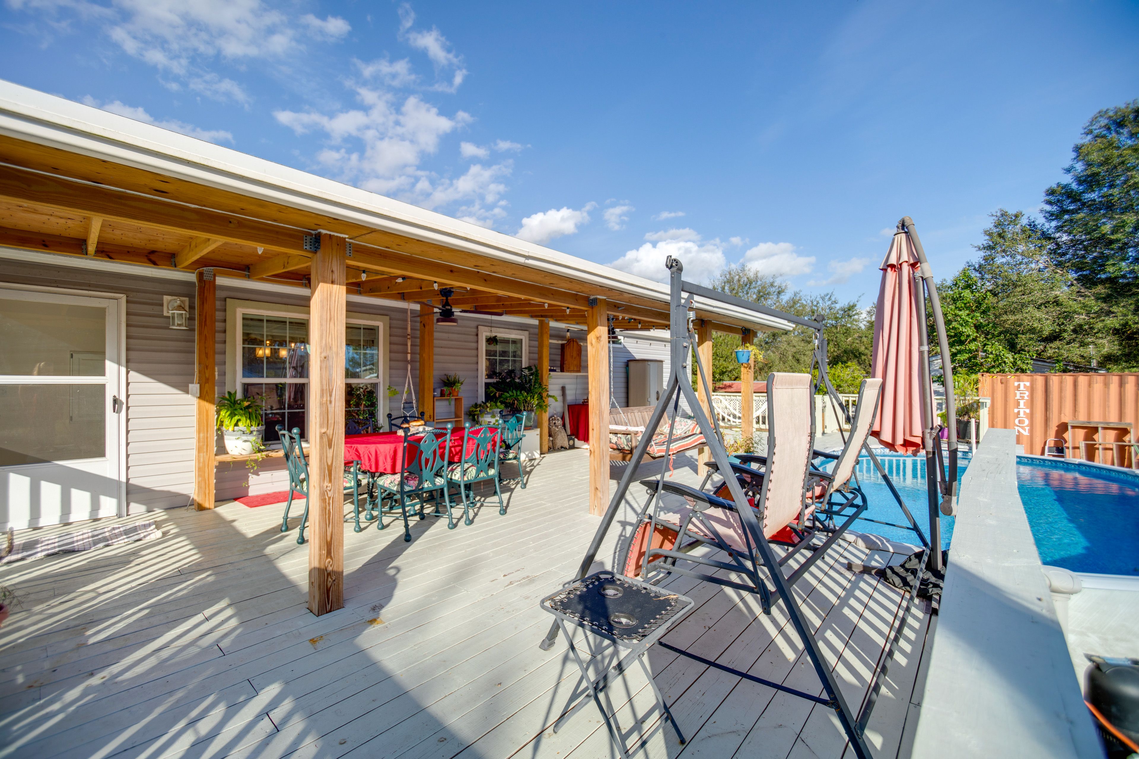 Covered Deck | Outdoor Dining Area | Bench Swings