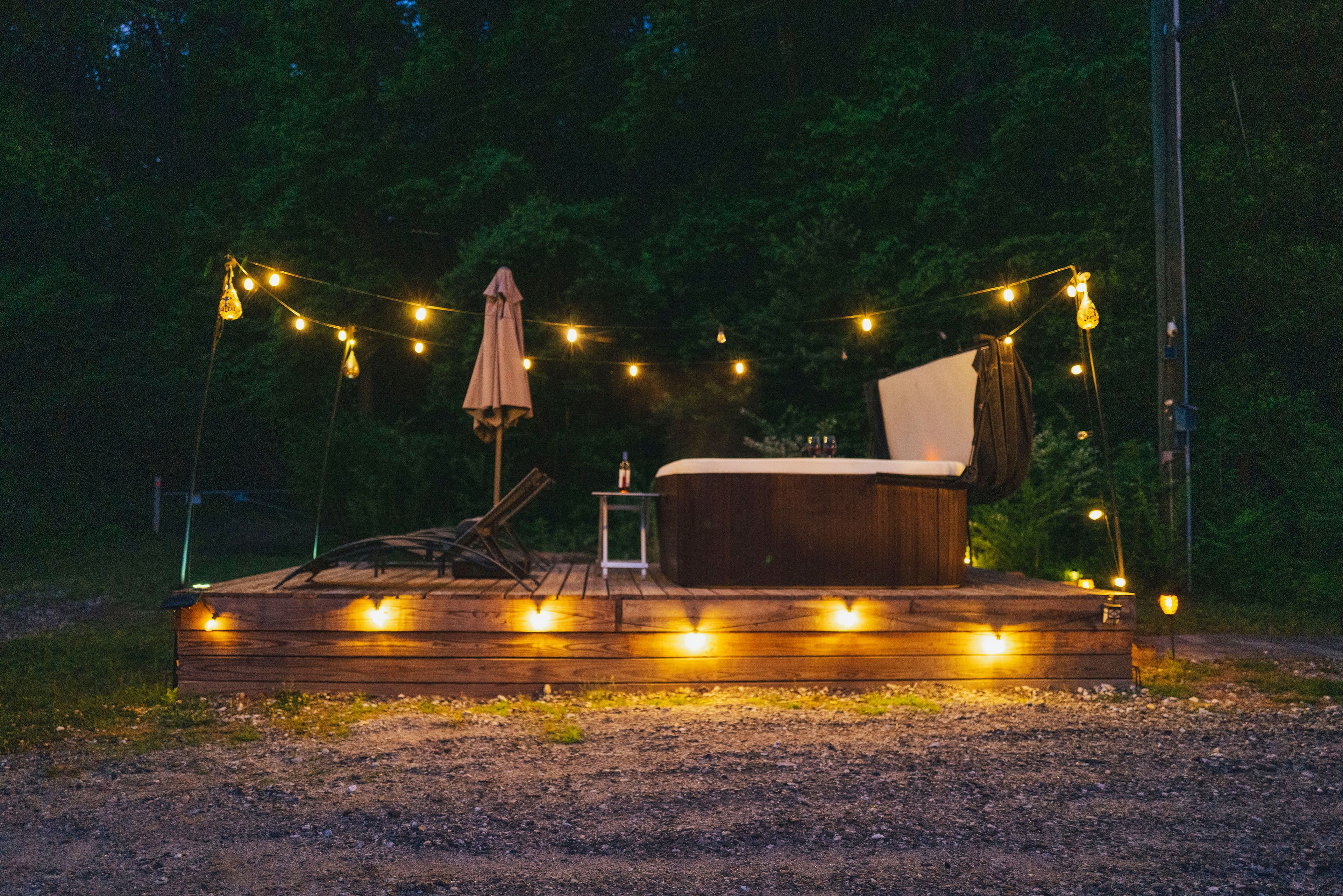 Unwind in the Hot Tub under the lights and Stars