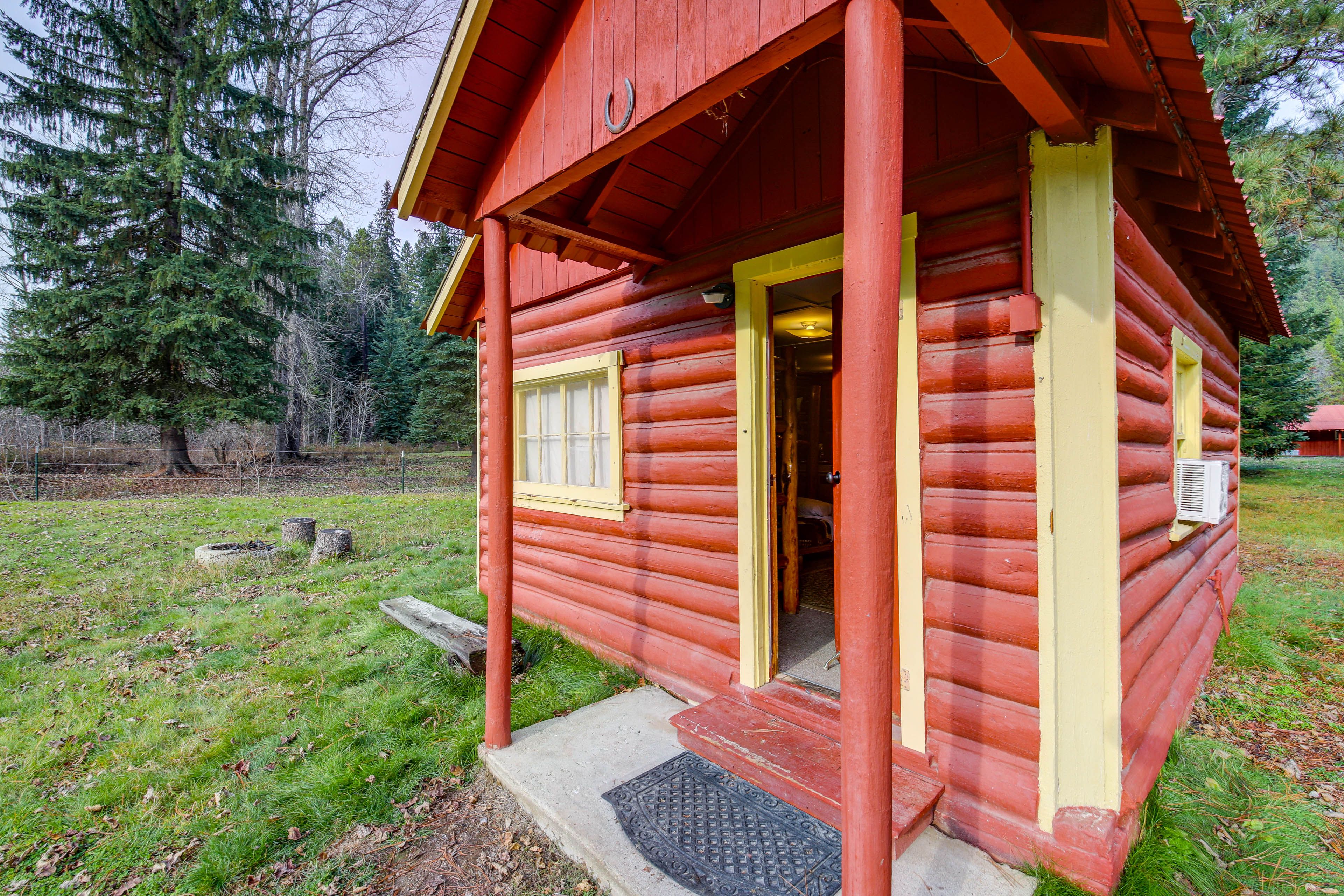 Cabin Exterior | Private Fire Pit | Designated Parking (2 Vehicles)