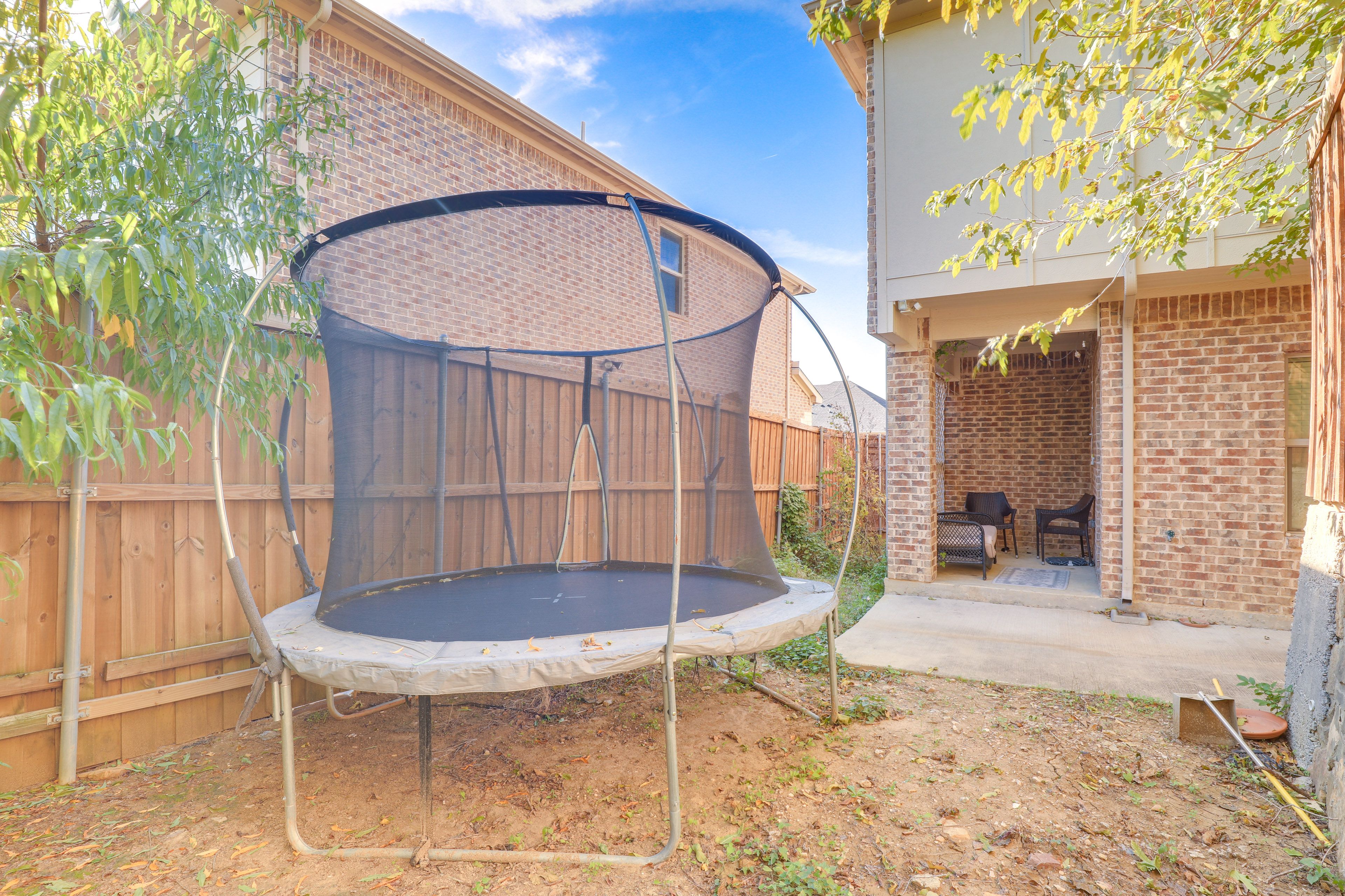 Backyard | Fenced In | Covered Patio | Trampoline