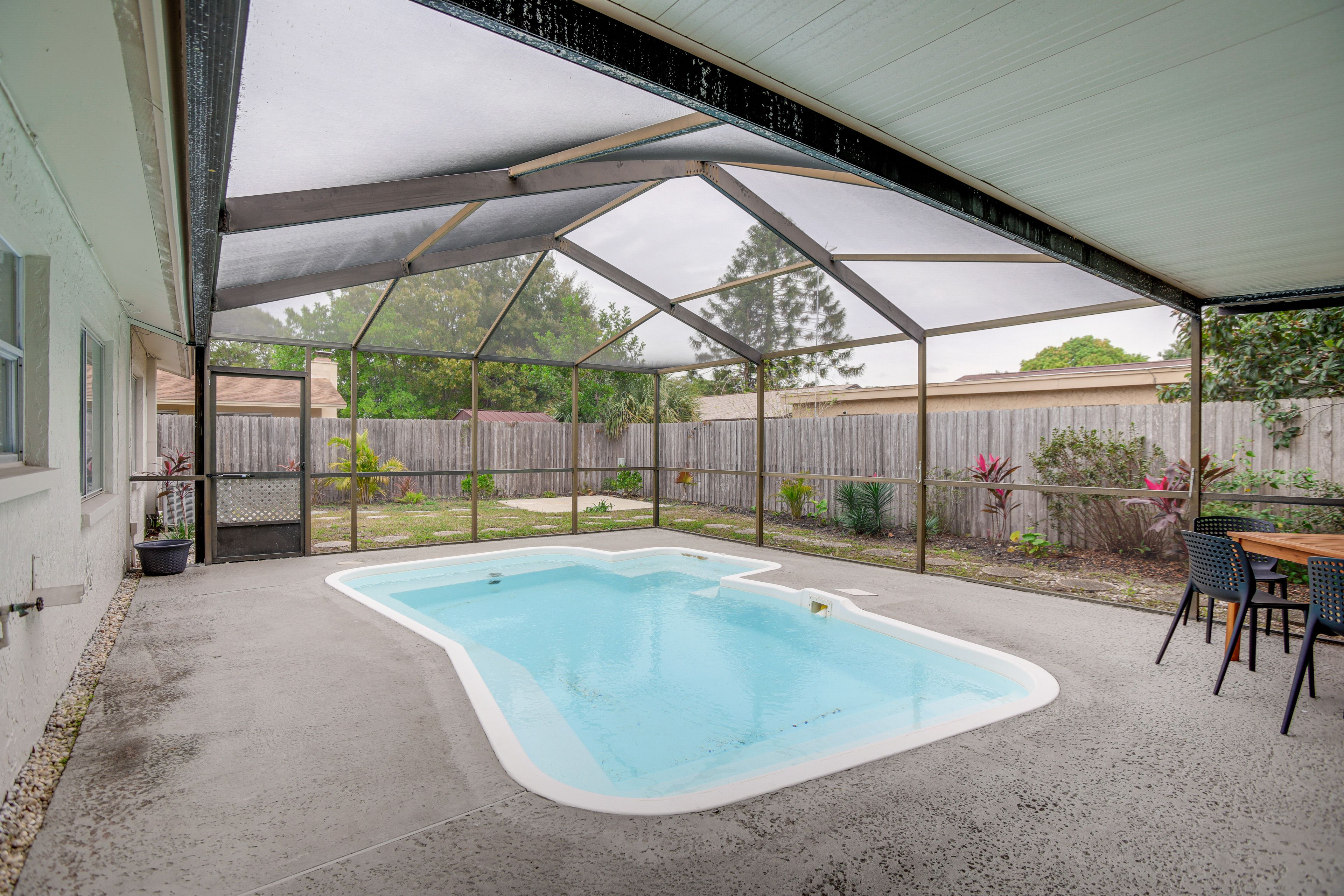 Private Backyard Area | Screened-In Lanai | Dining Area
