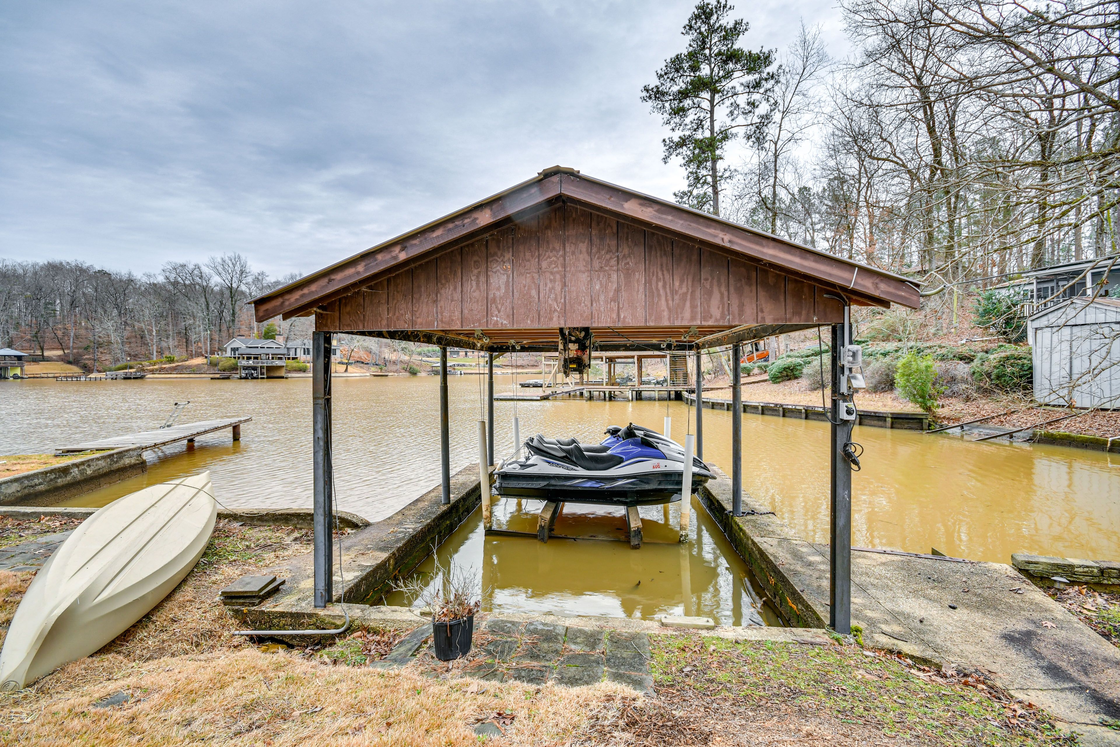 Cottage Exterior | Private Boathouse w/ Lift | 2 Swim Docks | Fishing Poles