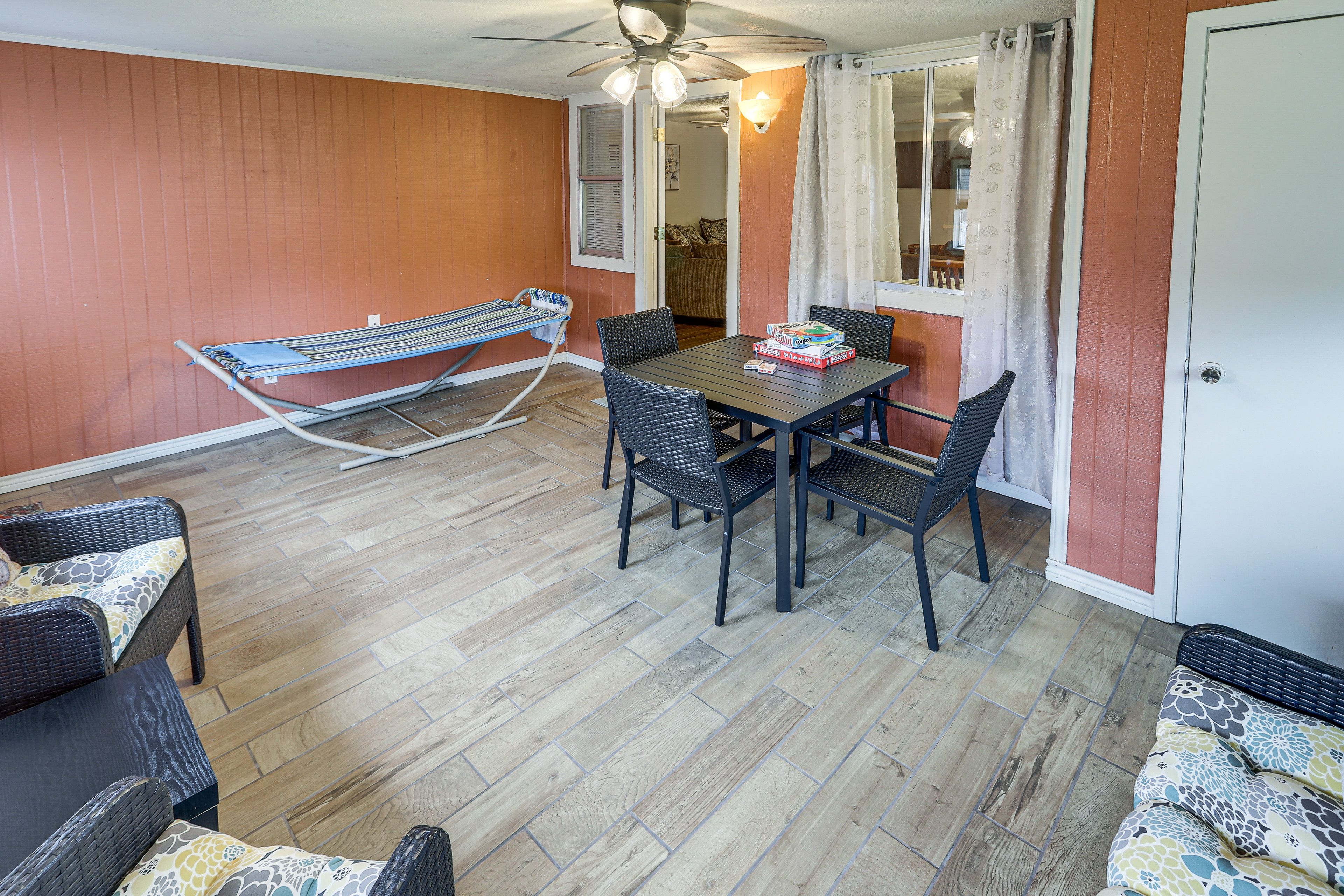 Sunroom | Outdoor Dining Area | Hammock | Fenced Backyard