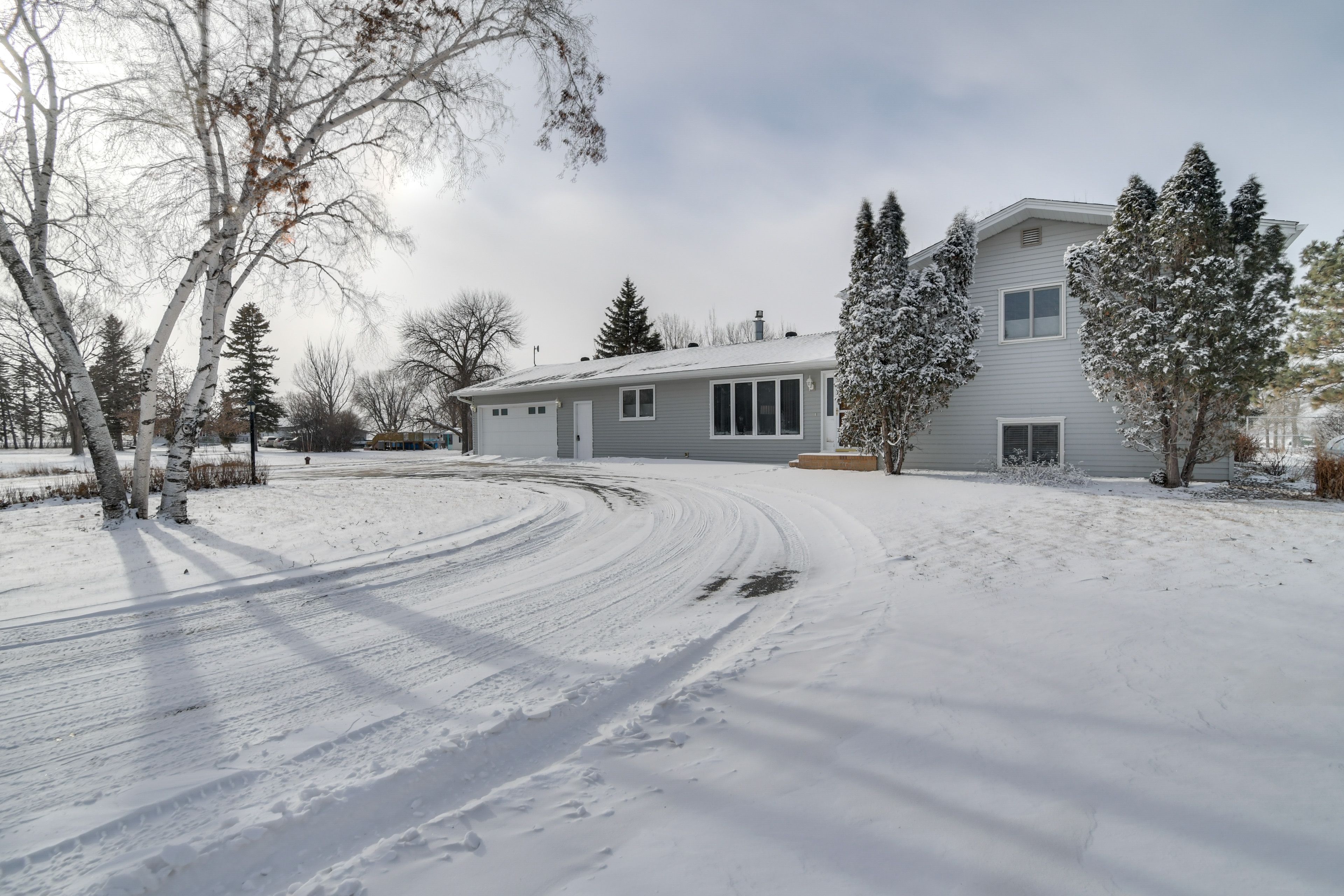 House Exterior | Heated Garage (2 Vehicles) | Circular Driveway (4 Vehicles)