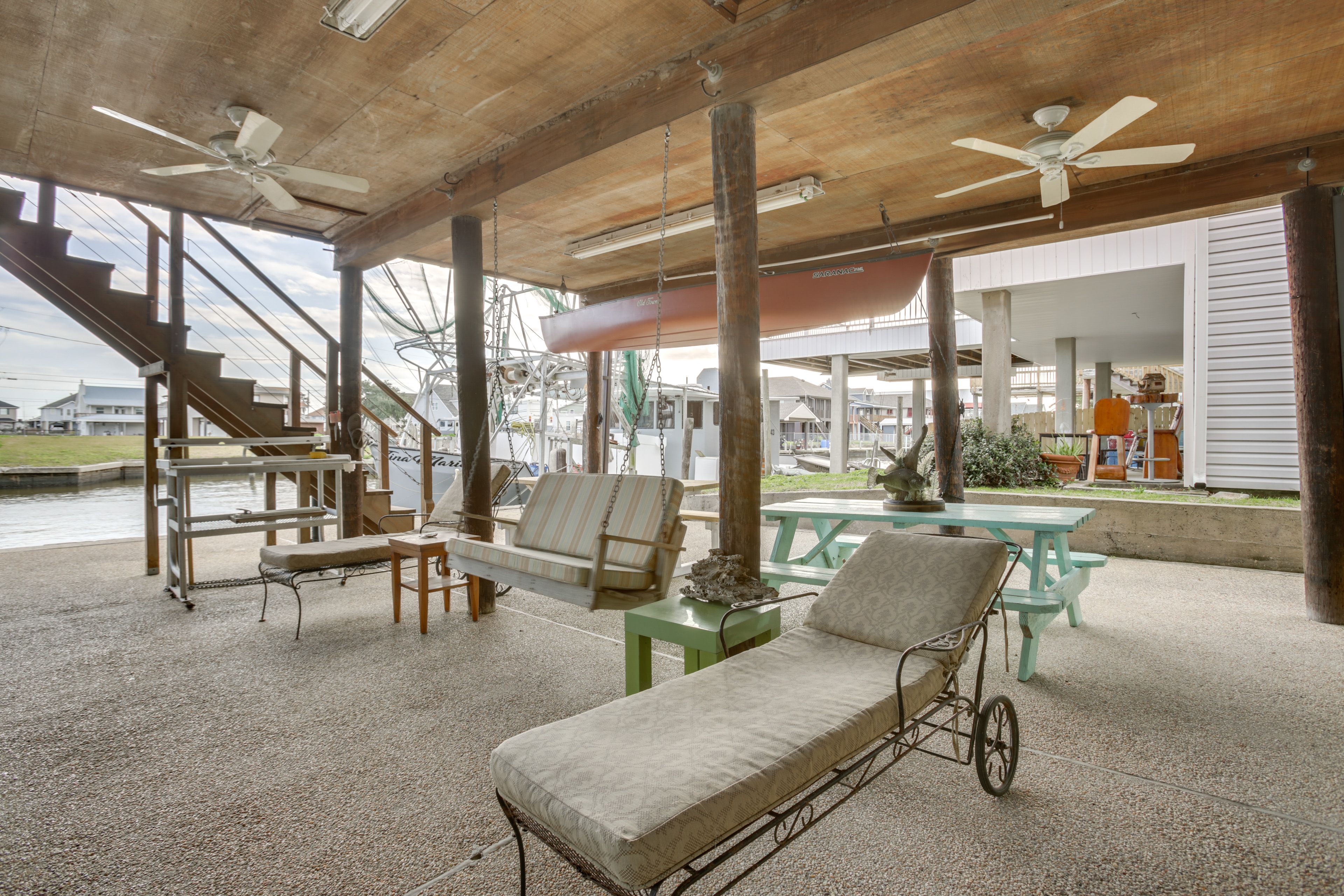 Lanai | Lower Level | Seating | Water View | Dining Tables