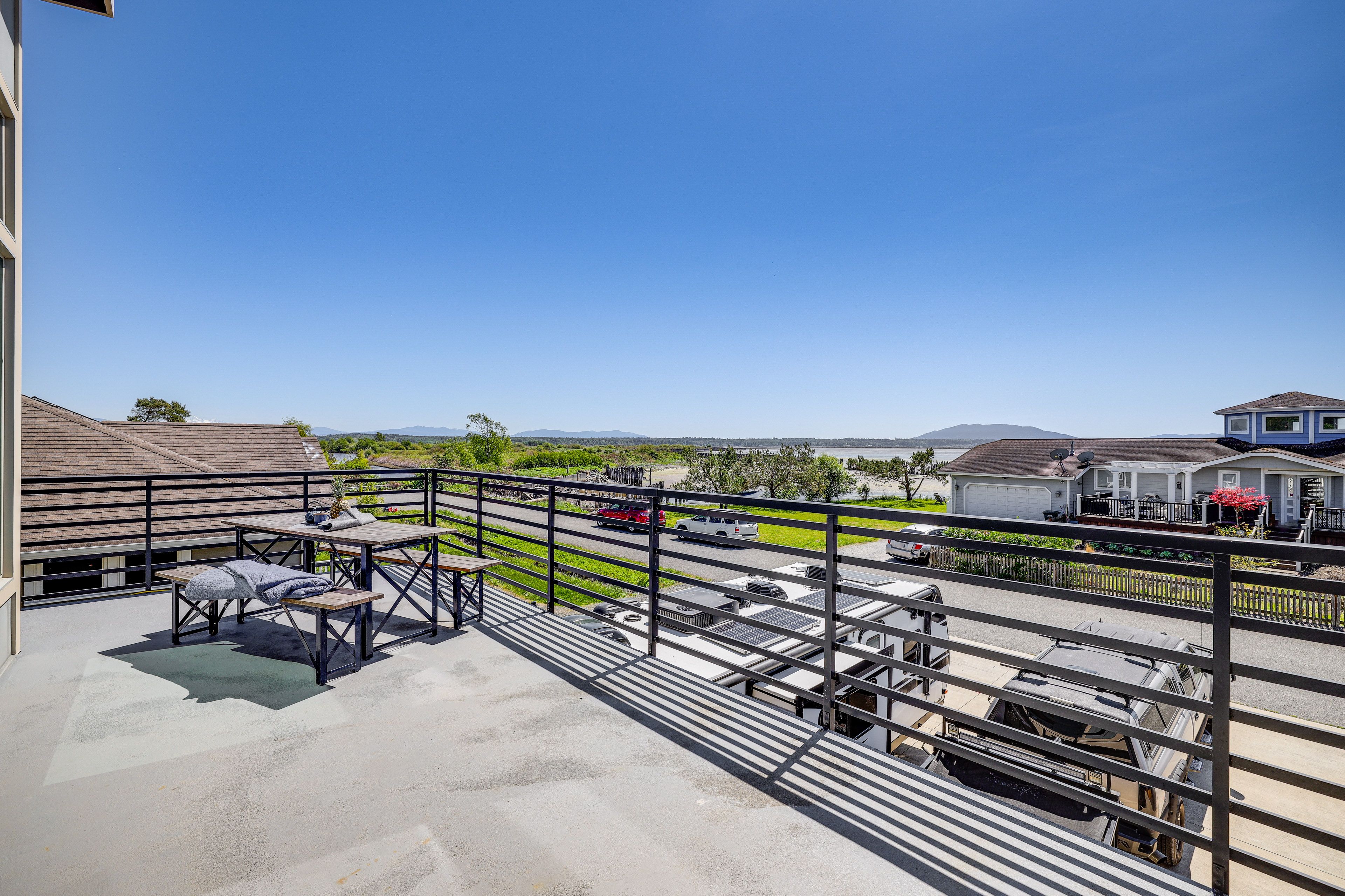 Deck | Outdoor Dining Area | Ocean & Mountain Views | Gas Grill