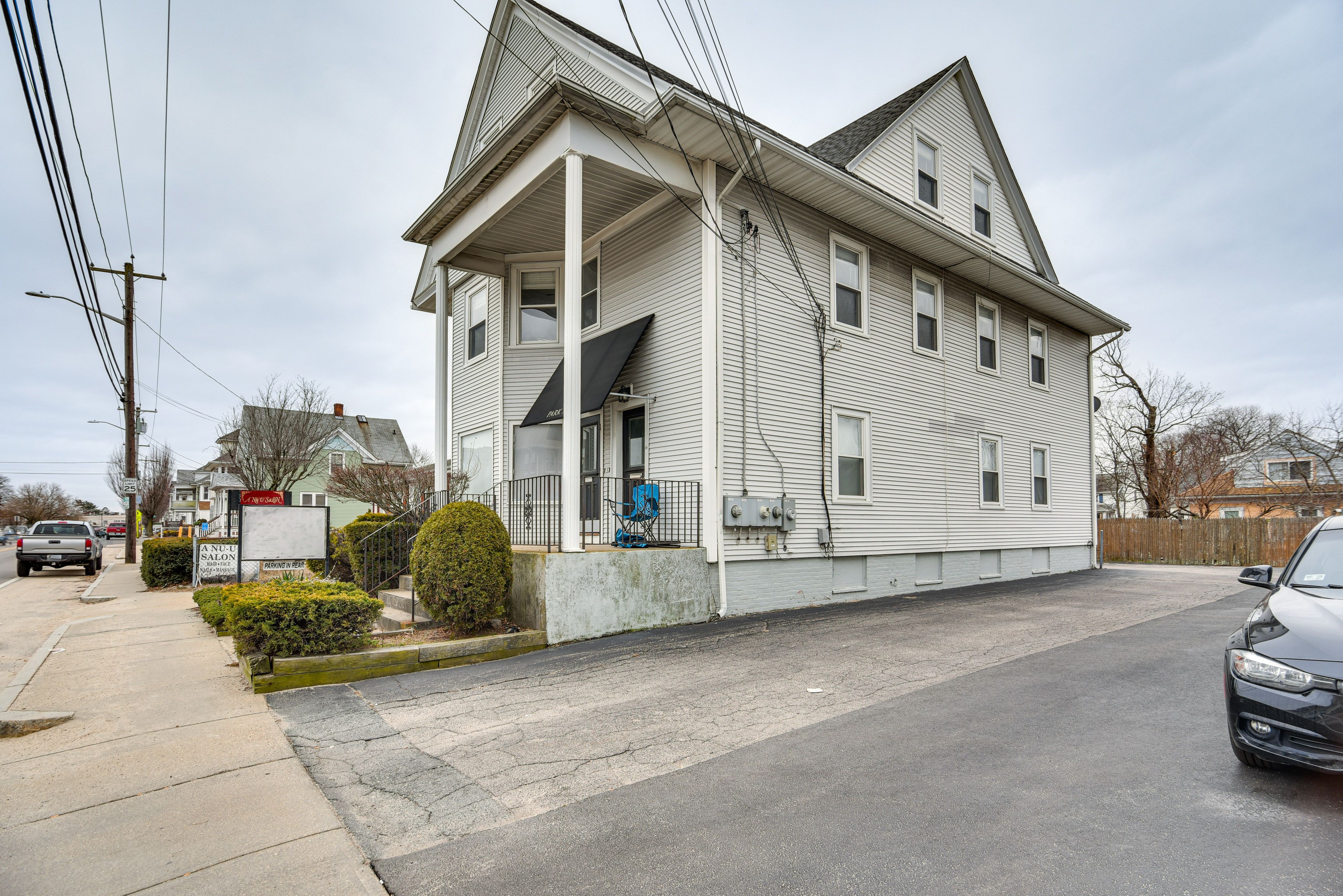 Home Exterior | Shared Parking Lot | Space for 3 Vehicles