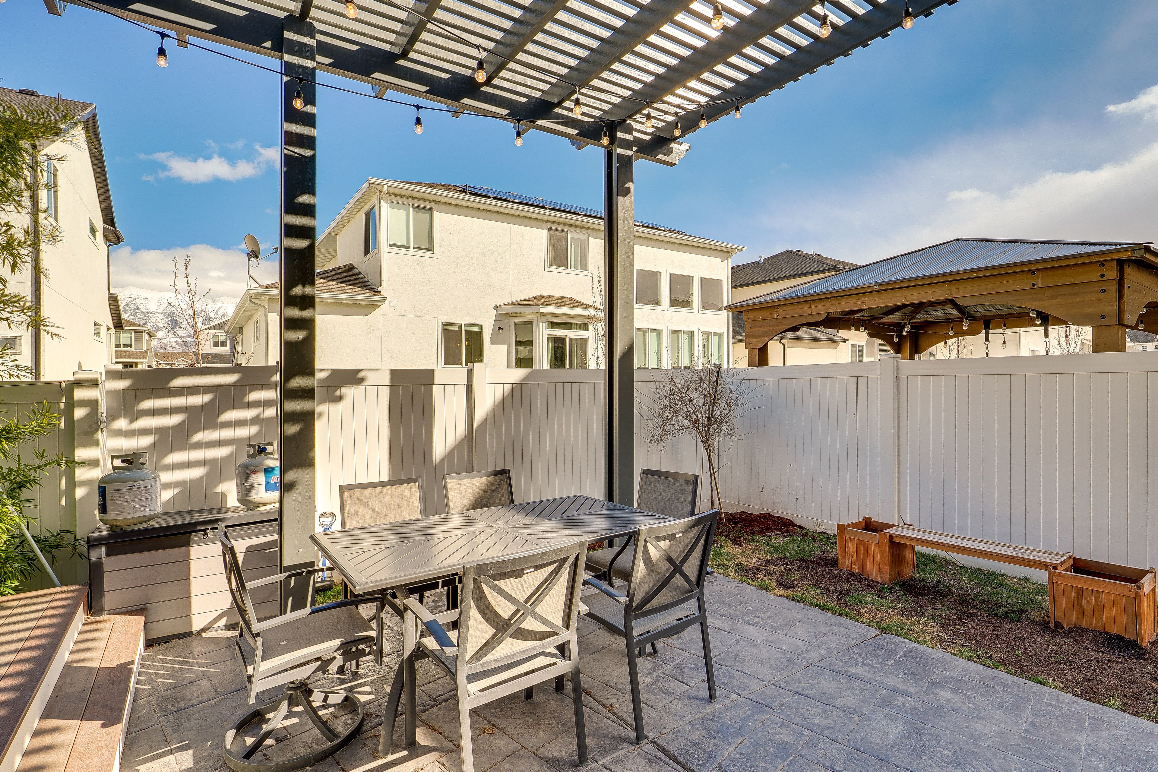 Studio Exterior | Shared Patio w/ Dining Area