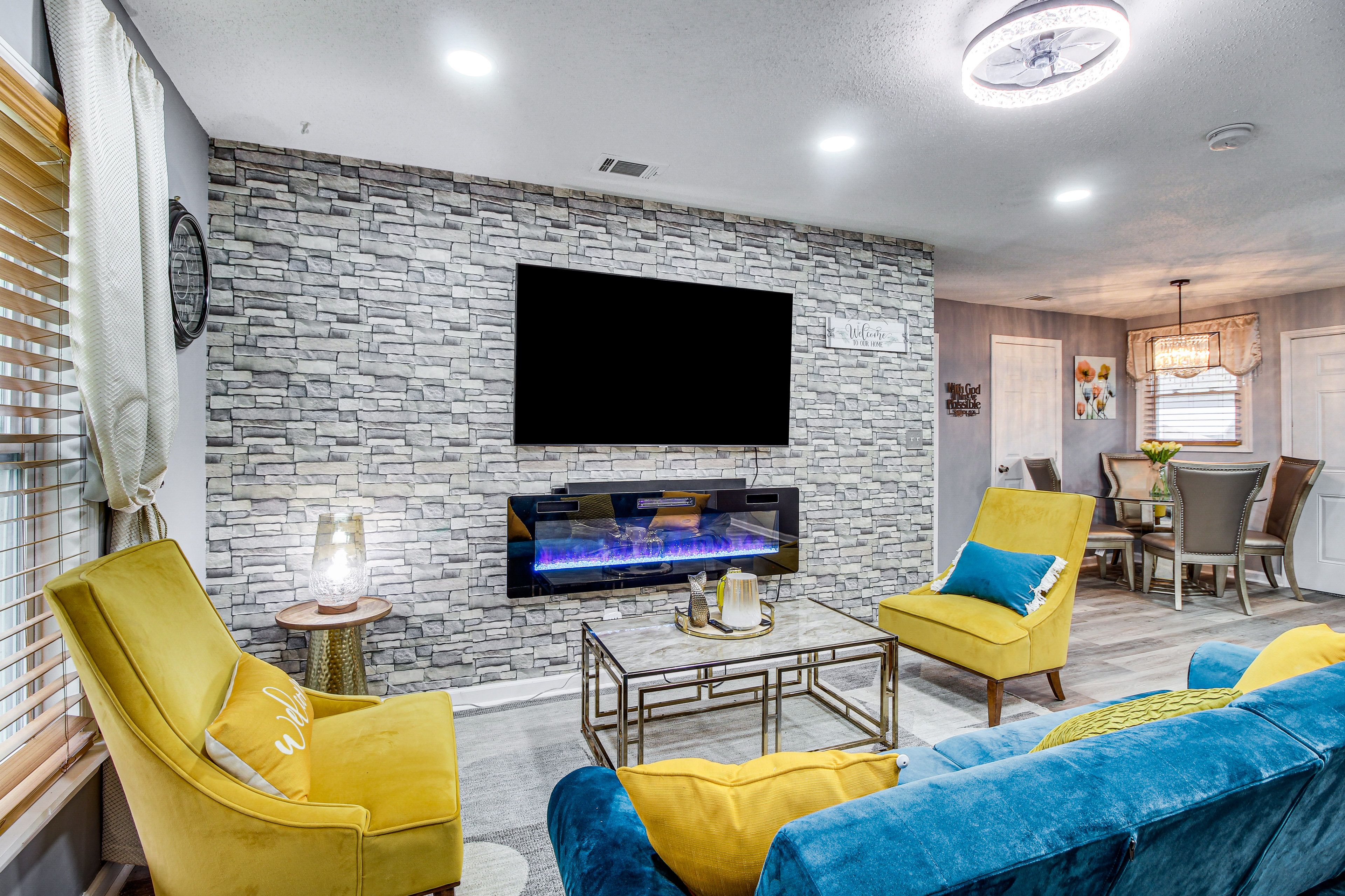 Living Room | Electric Fireplace | 65" Smart TV | Central A/C & Heating | Futon