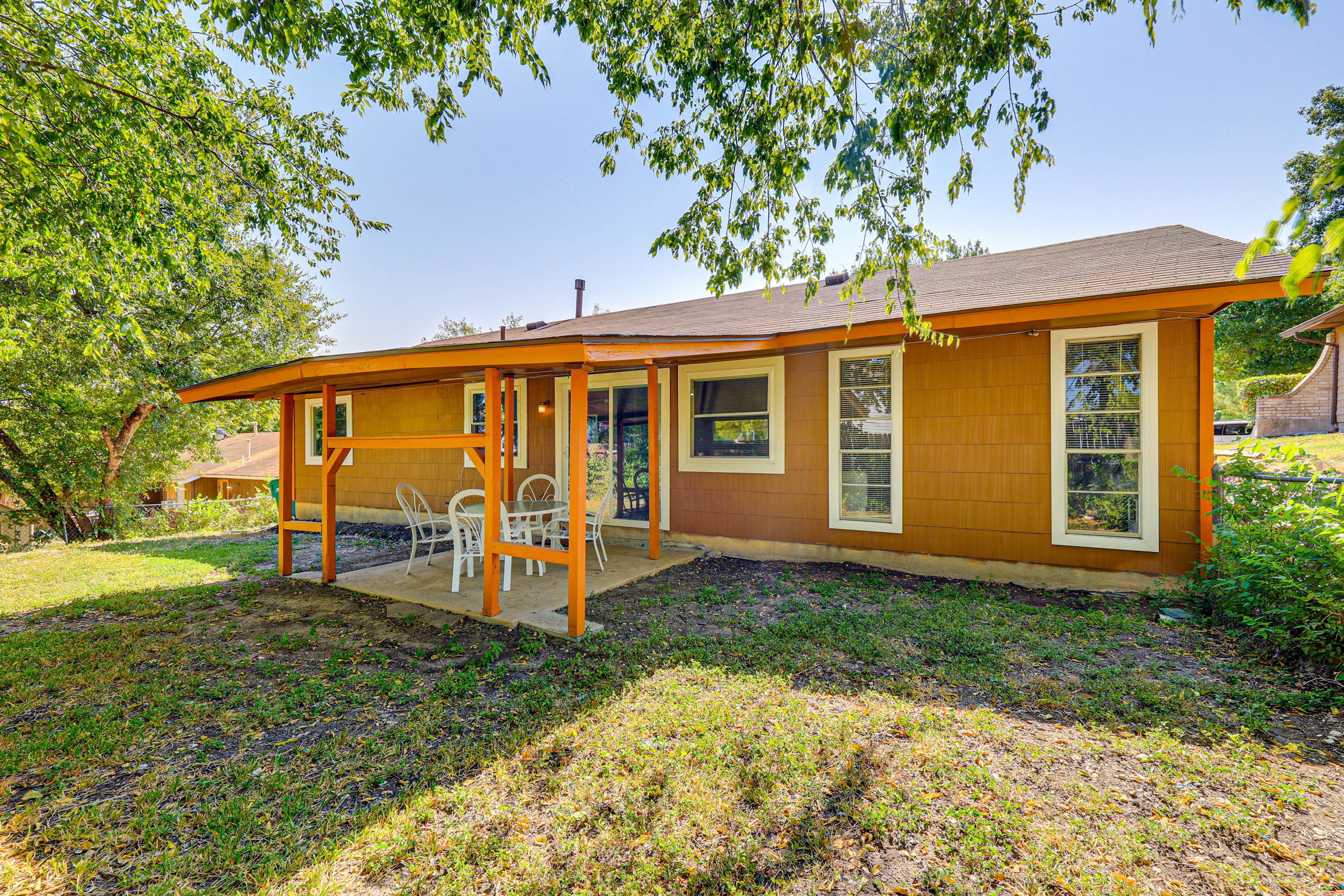 Property Exterior | Single-Story Home | Spacious Yard | Outdoor Dining Table