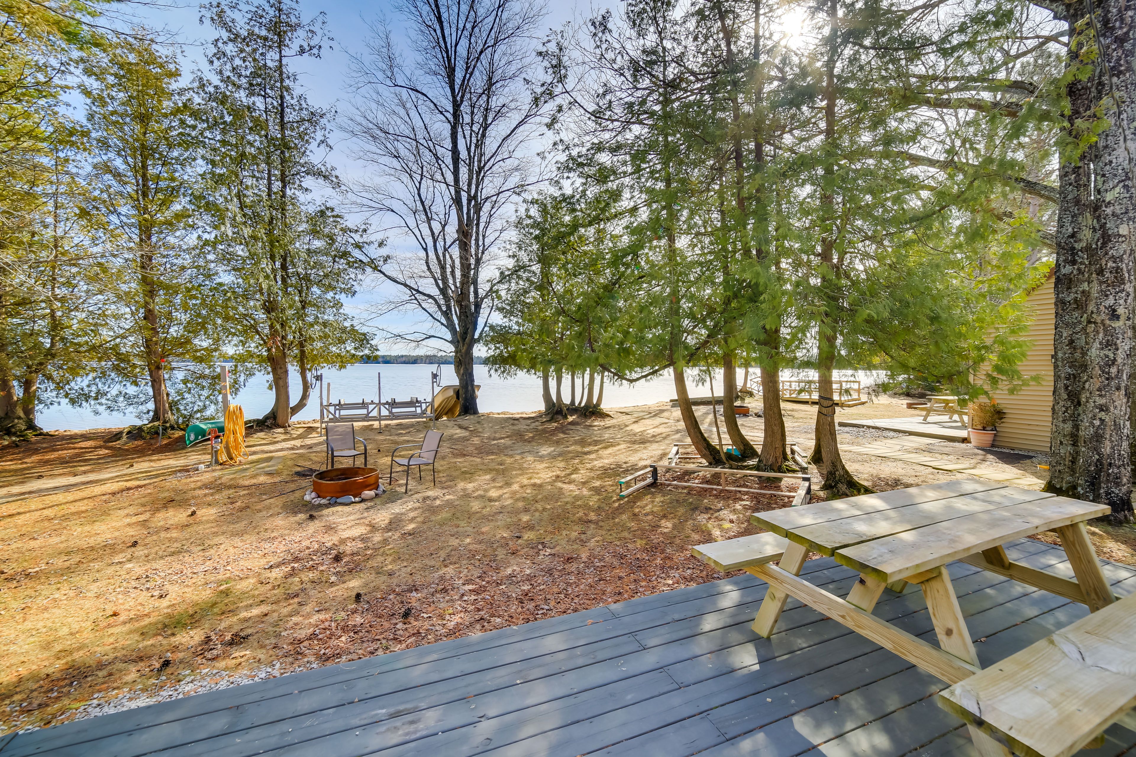 Deck & Backyard | Outdoor Seating Areas | Fire Pit | Muskallonge Lake Views