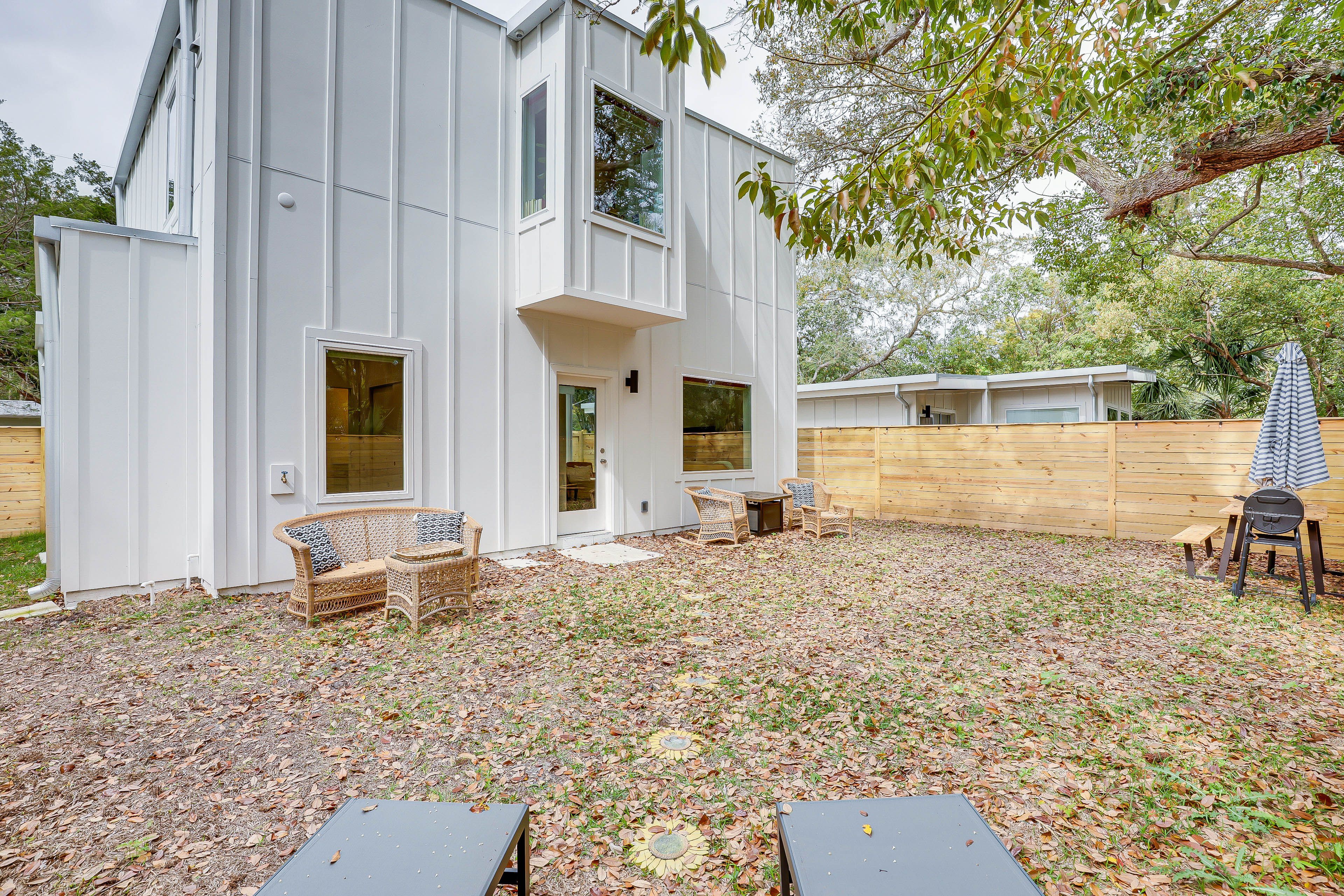 House Exterior | Fire Pit | Picnic Table | Charcoal Grill | Fenced Backyard