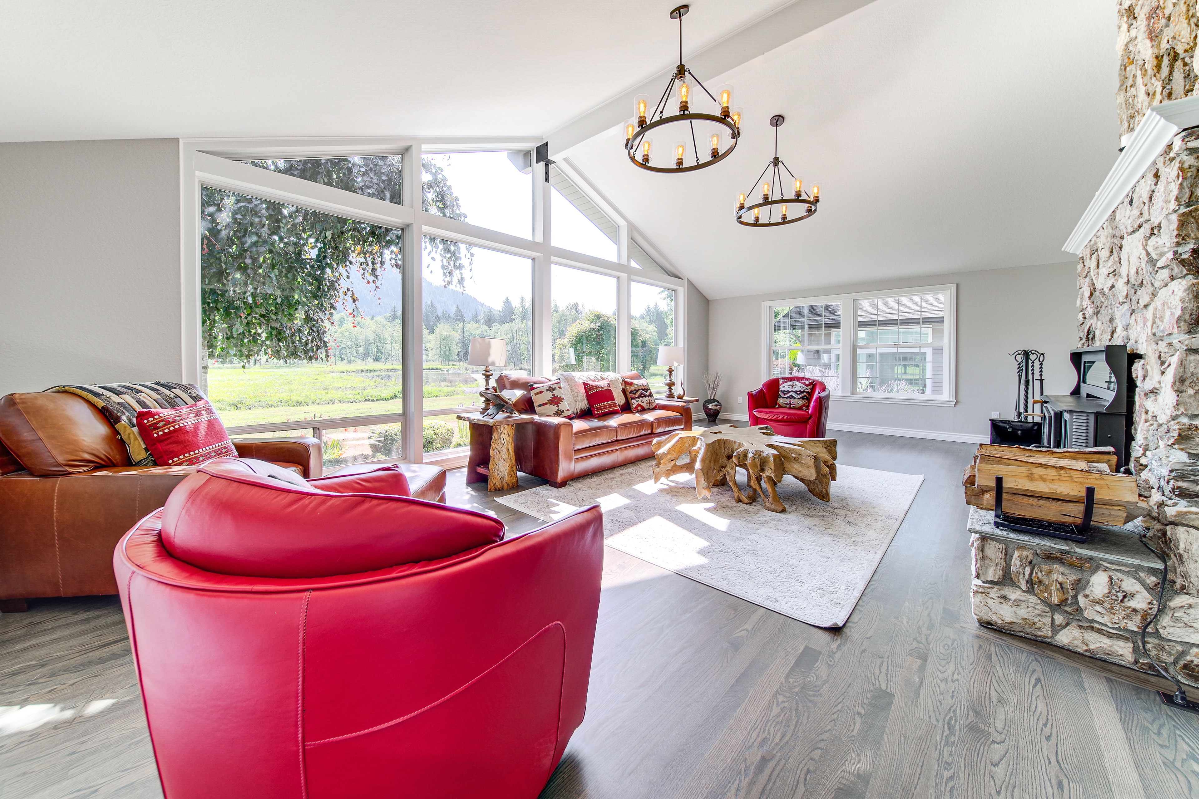 Living Room | Stone Fireplace | Pond Views | 1st Floor