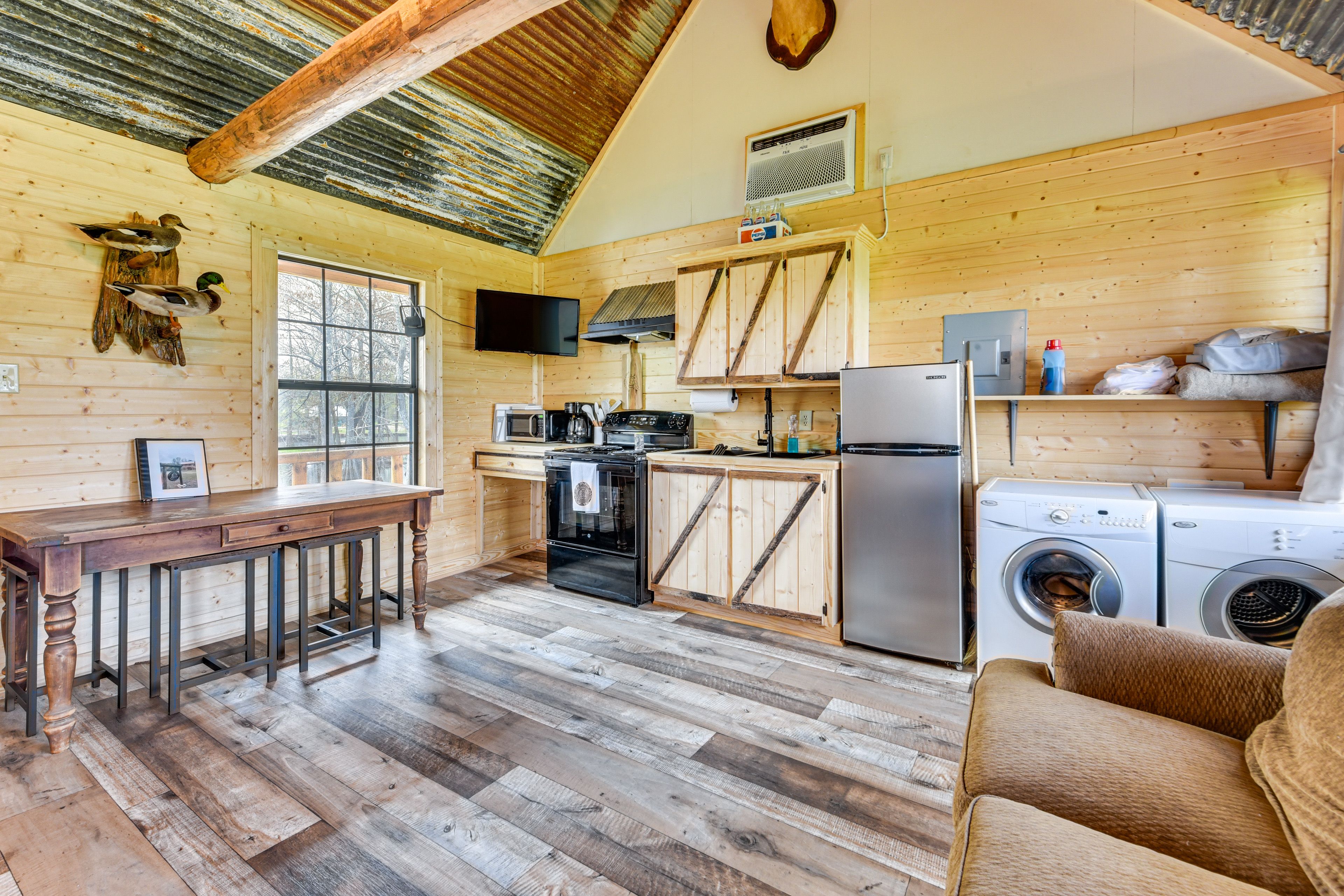 Living Area | Main Level | Washer/Dryer | Flat-Screen TV | Central A/C