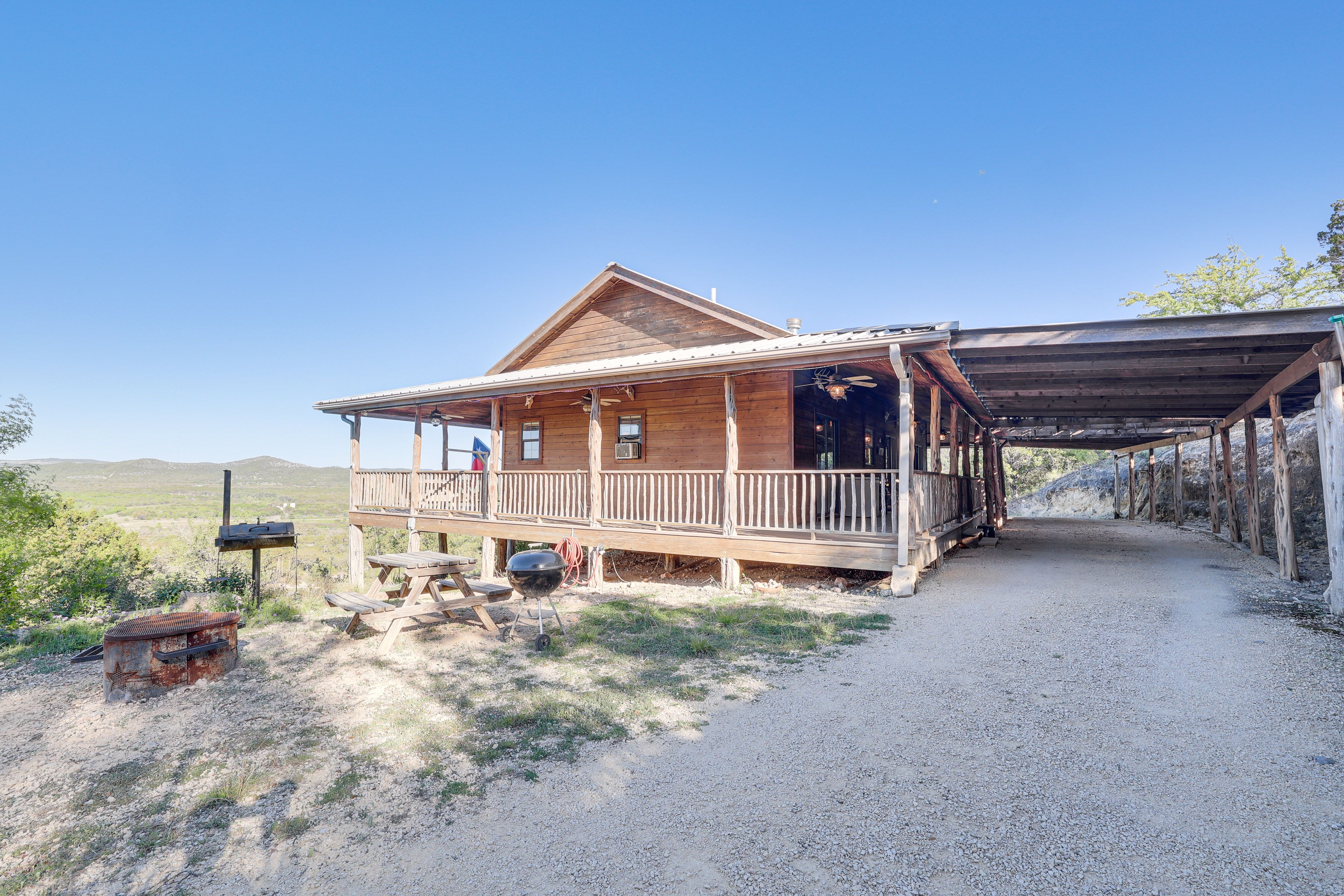 Cabin Exterior | Charcoal Grill | Fire Pit | Wraparound Deck | 44-Acre Property