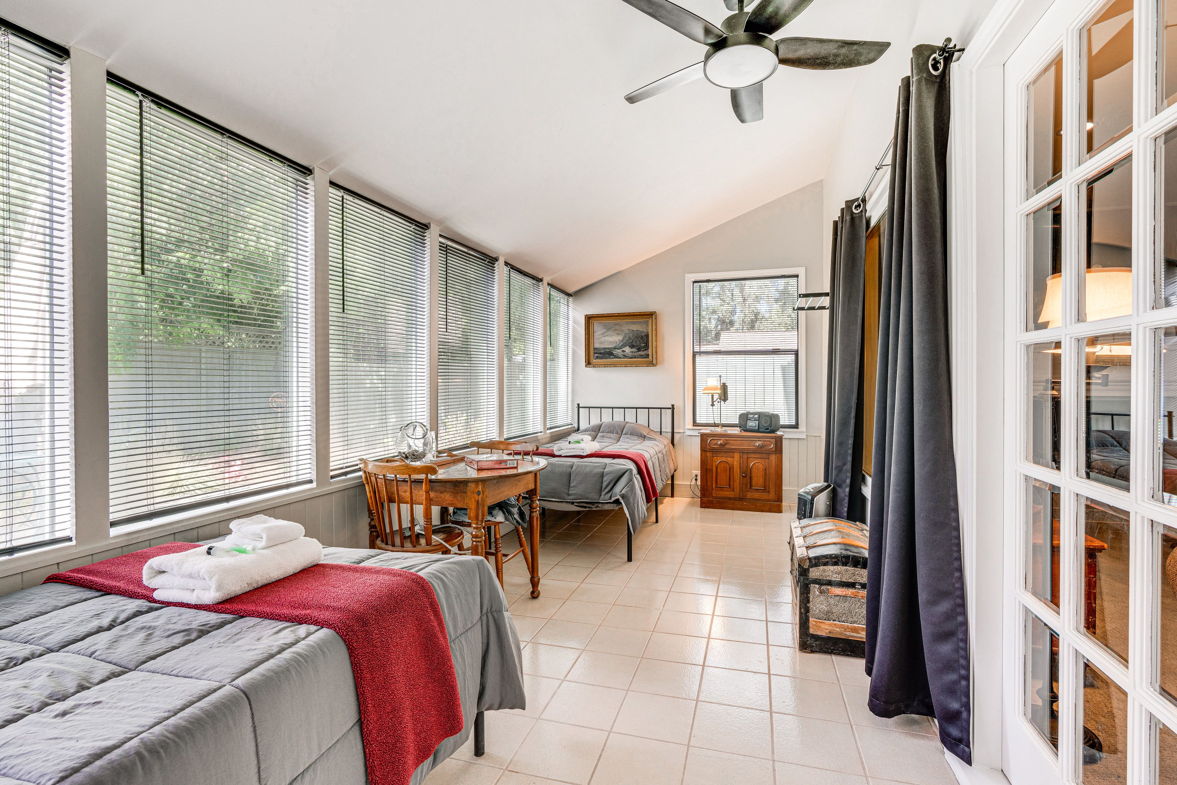 Bedroom 4 (Sunroom) | 1st Floor | 2 Twin XL Beds | Dining Table