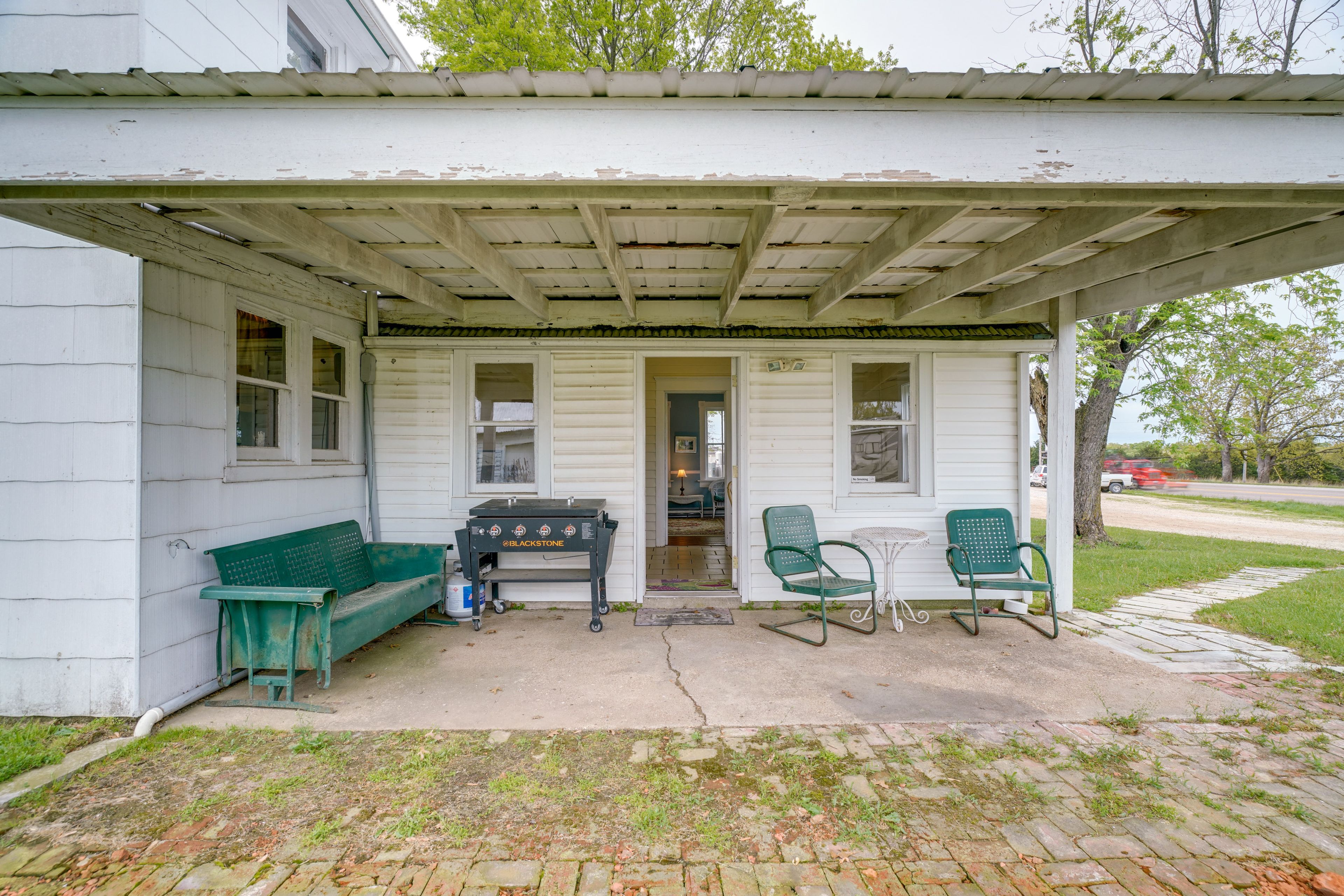 Covered Patio | Blackstone Grill | Lounge Seating