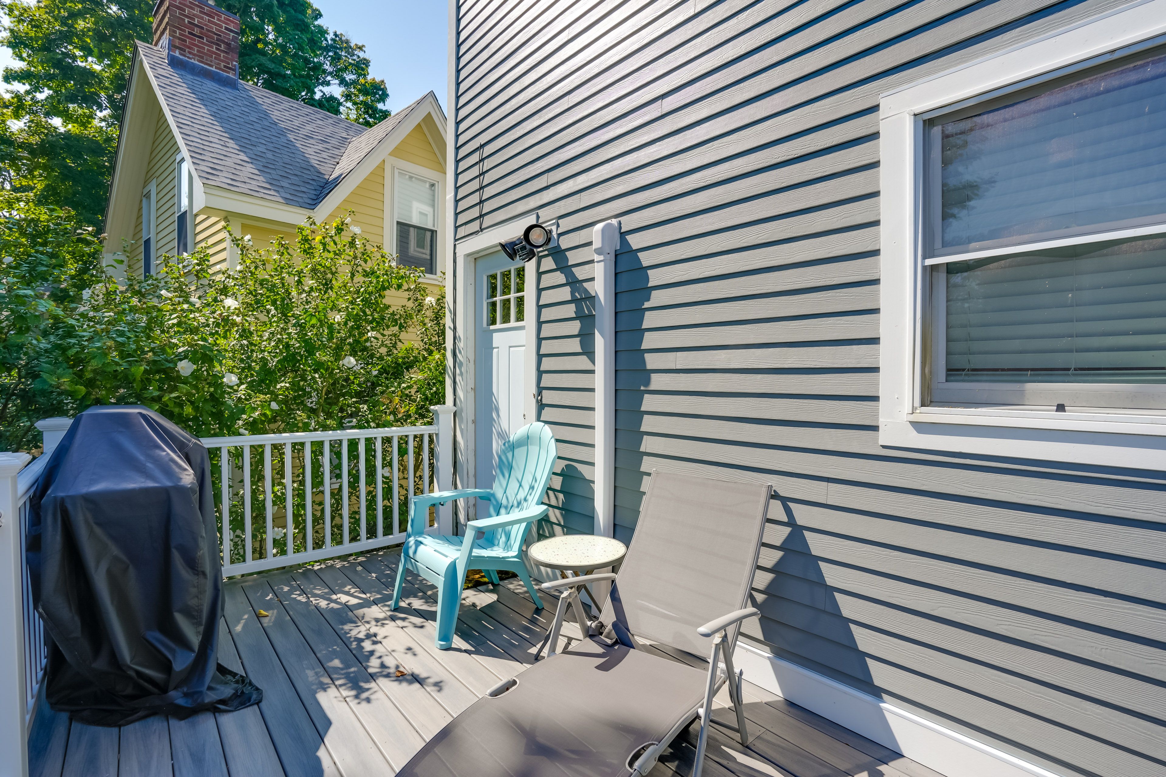 Condo Exterior | Shared Deck & Gas Grill