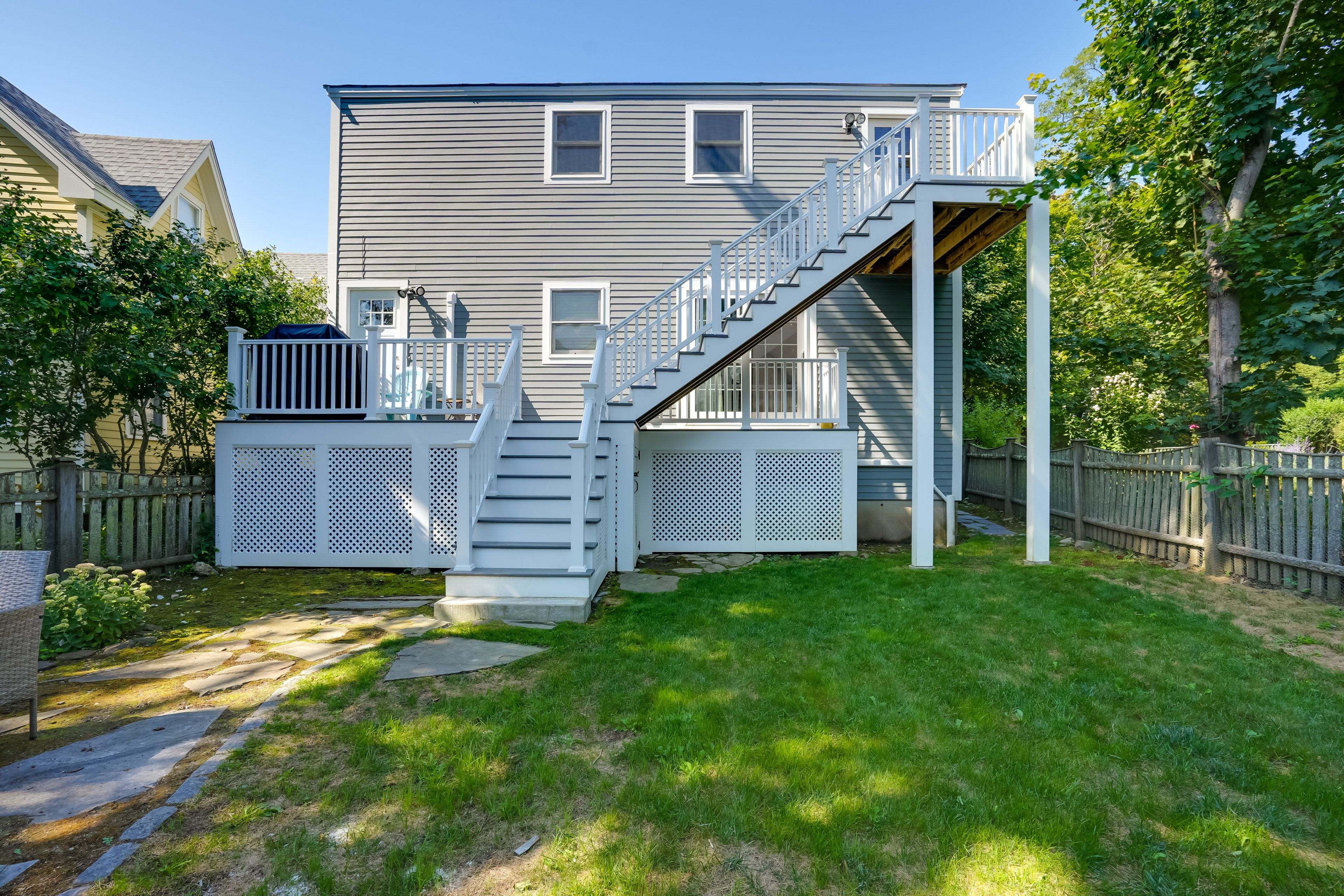 Condo Exterior | Shared Backyard w/ Seating