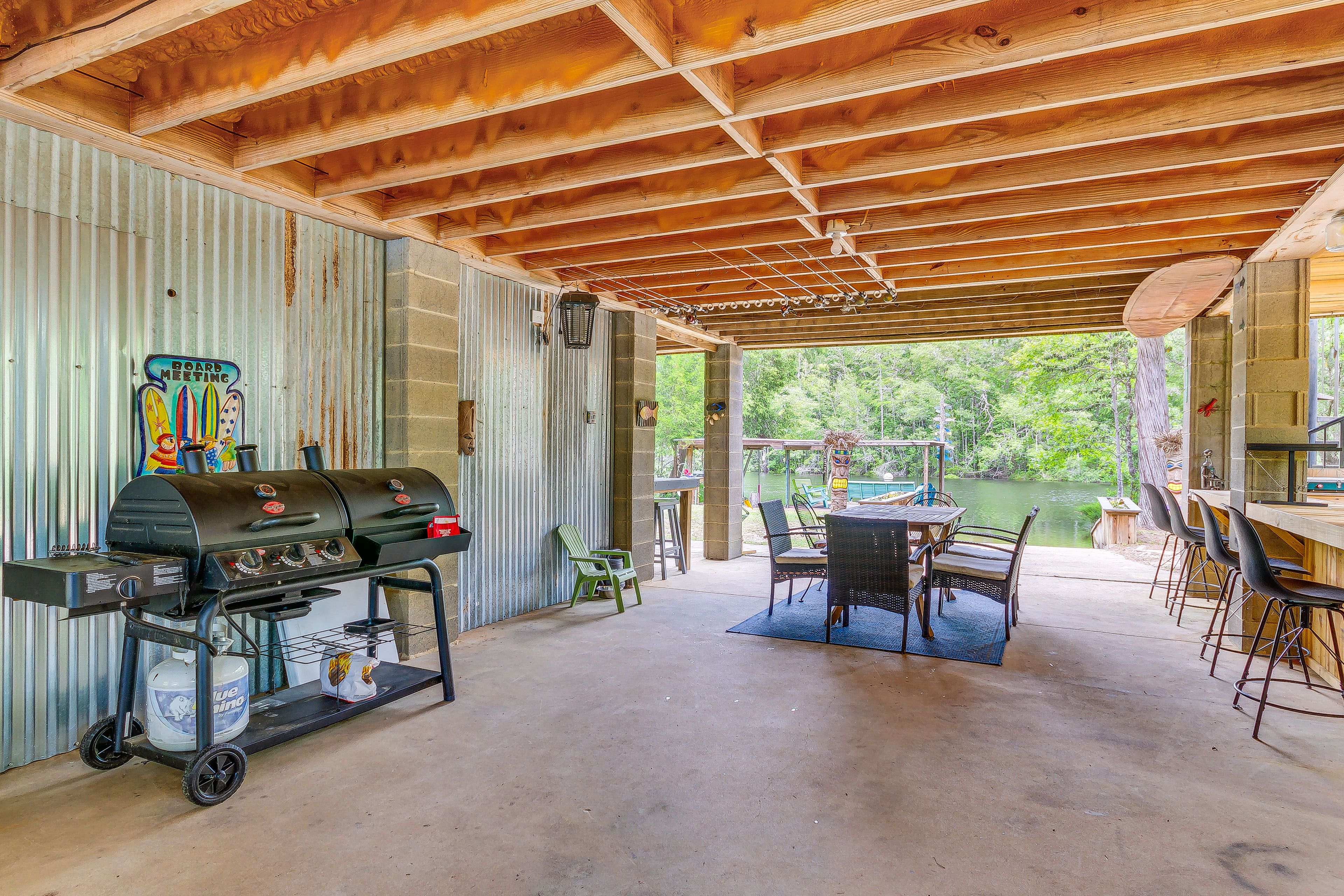 Patio | Gas Grill | Outdoor Dining Area + Bar | River Views