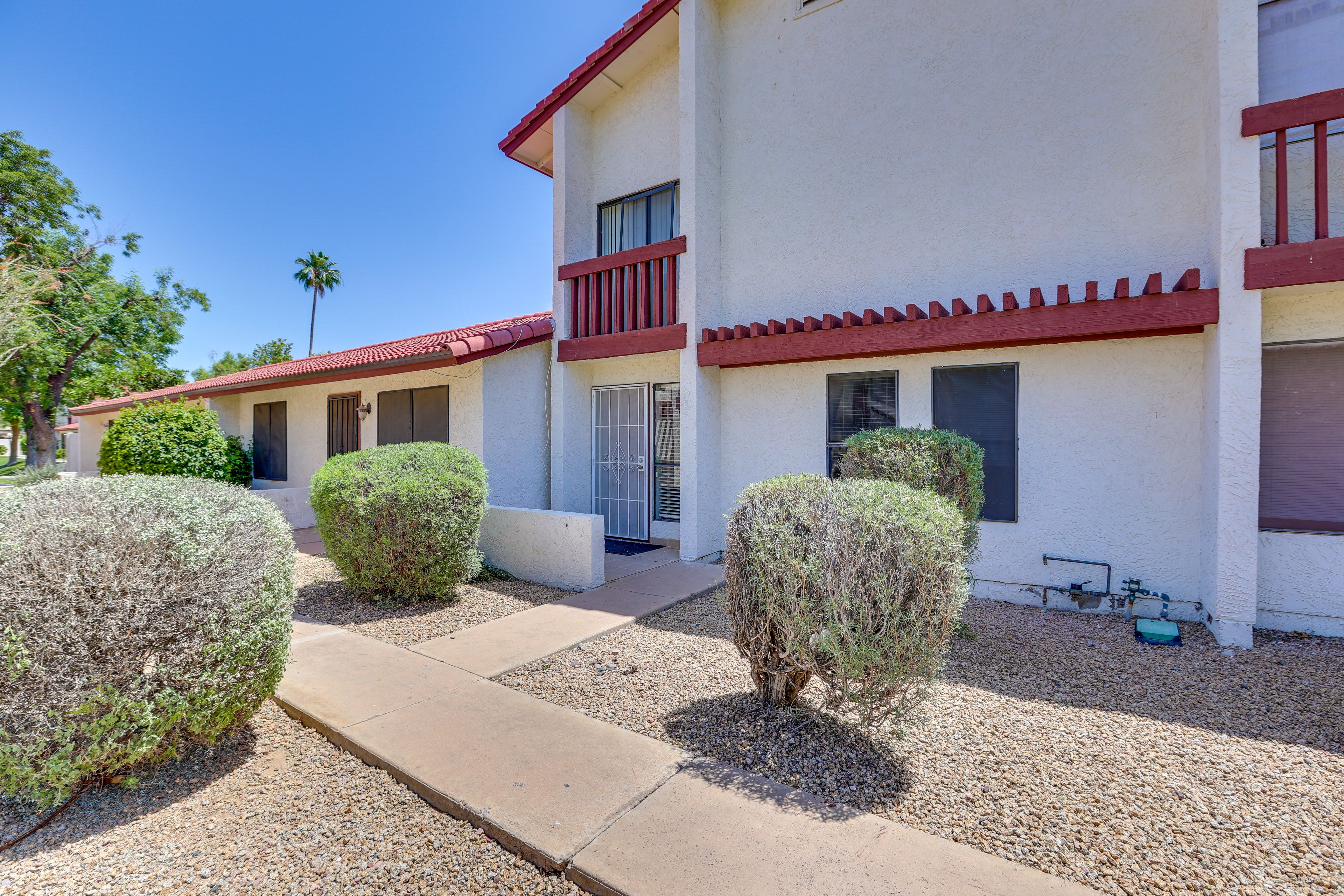 Townhouse Exterior | Private Back Patio | Community Pool Access