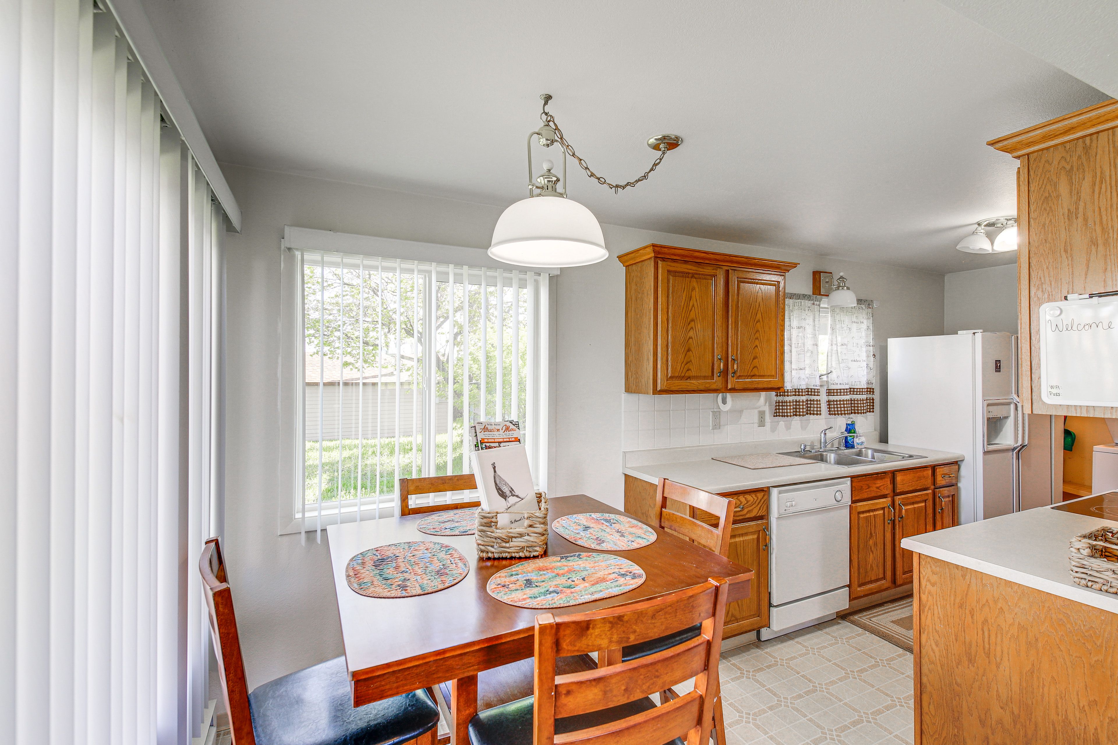 Dining Area | Dishware & Flatware Provided | Window A/C Unit | 1st Floor