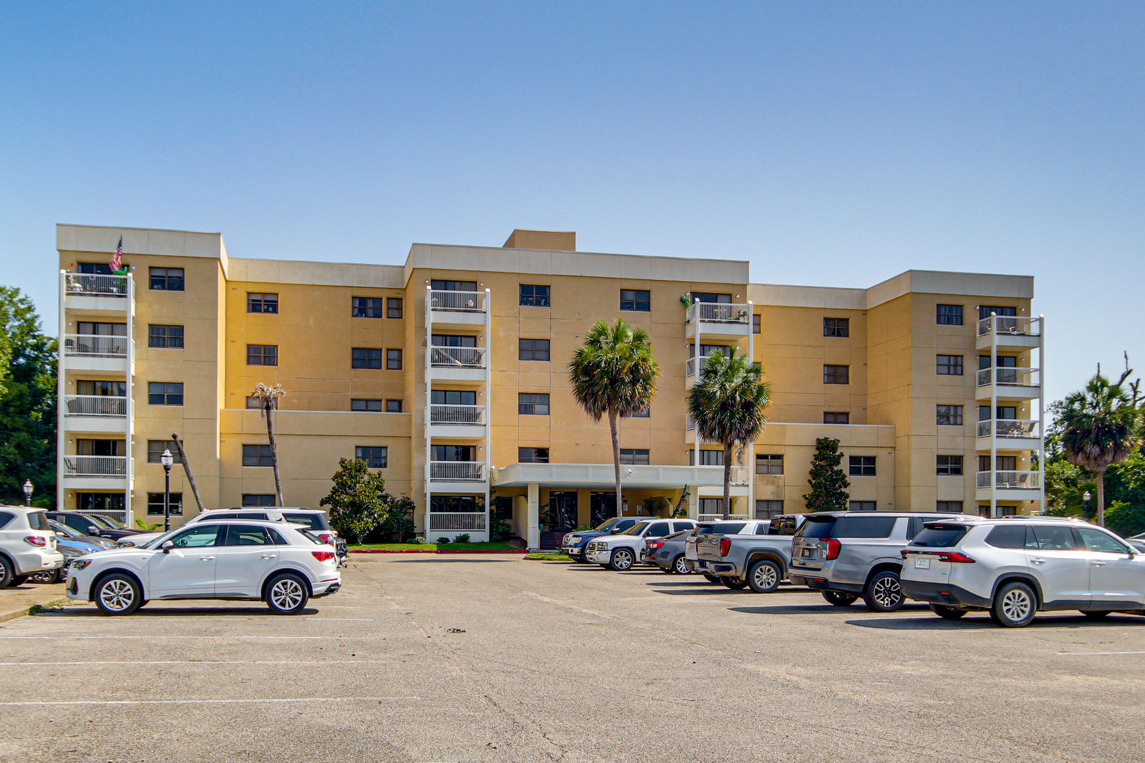 Building Exterior | Open Community Parking Lot (3 Vehicles)