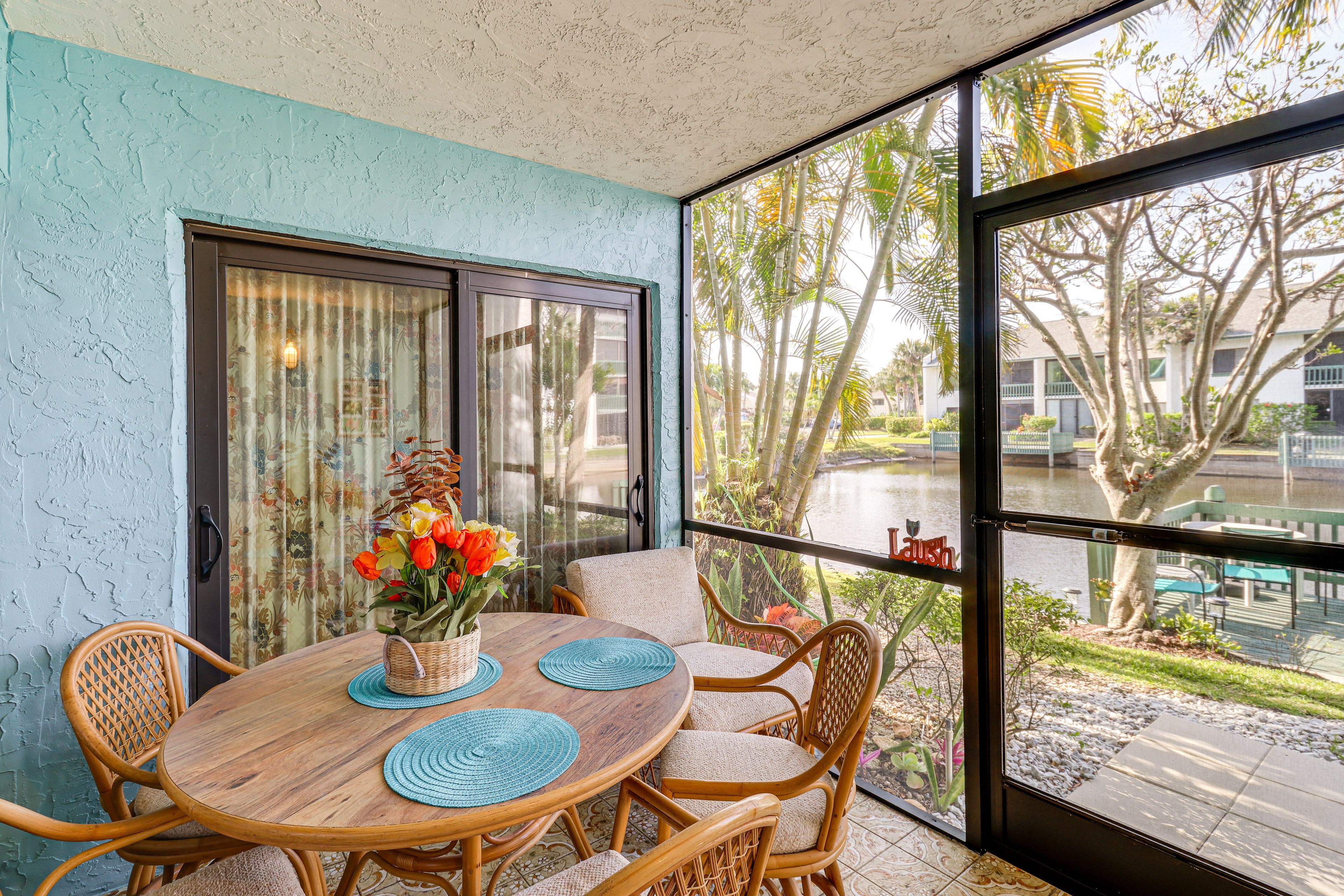 Condo Exterior | Screened Patio | Dining Area | Charcoal Grill