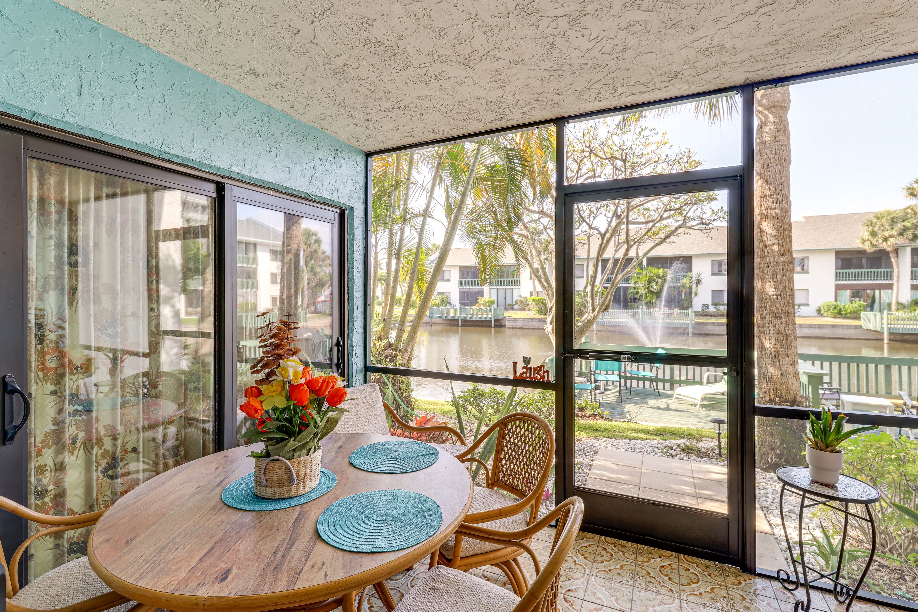 Condo Exterior | Screened Patio | Dining Area | Charcoal Grill