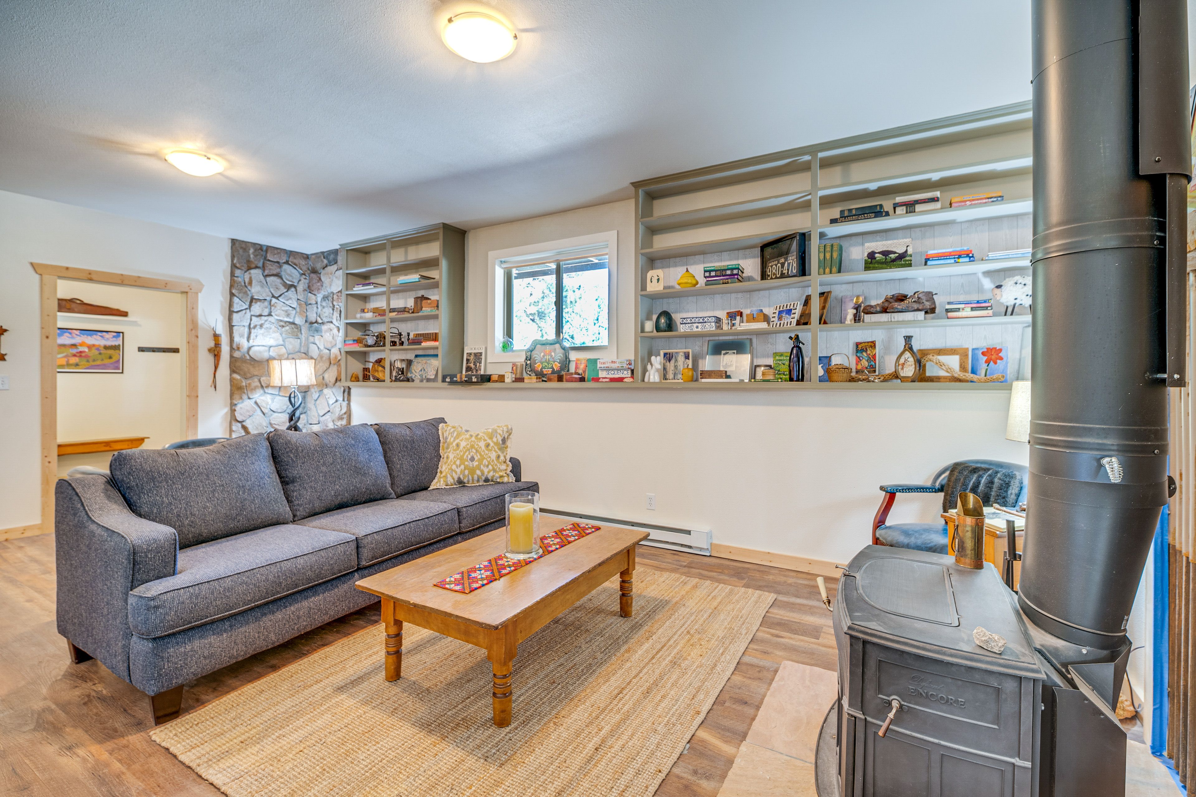 Lower Living Area | Wood-Burning Stove | Shuffleboard | Basement