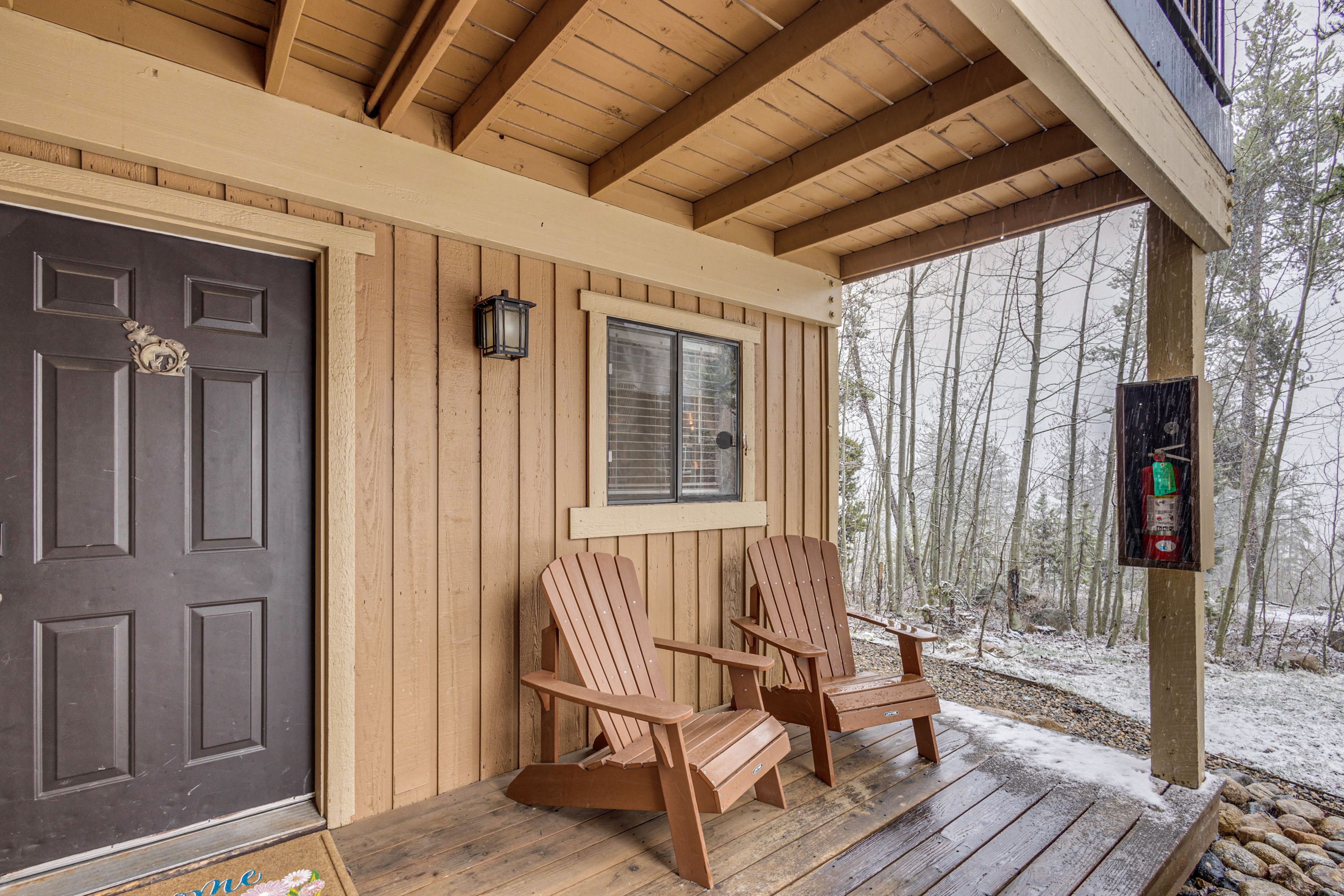 Unit Entrance | Porch w/ Adirondack Chairs