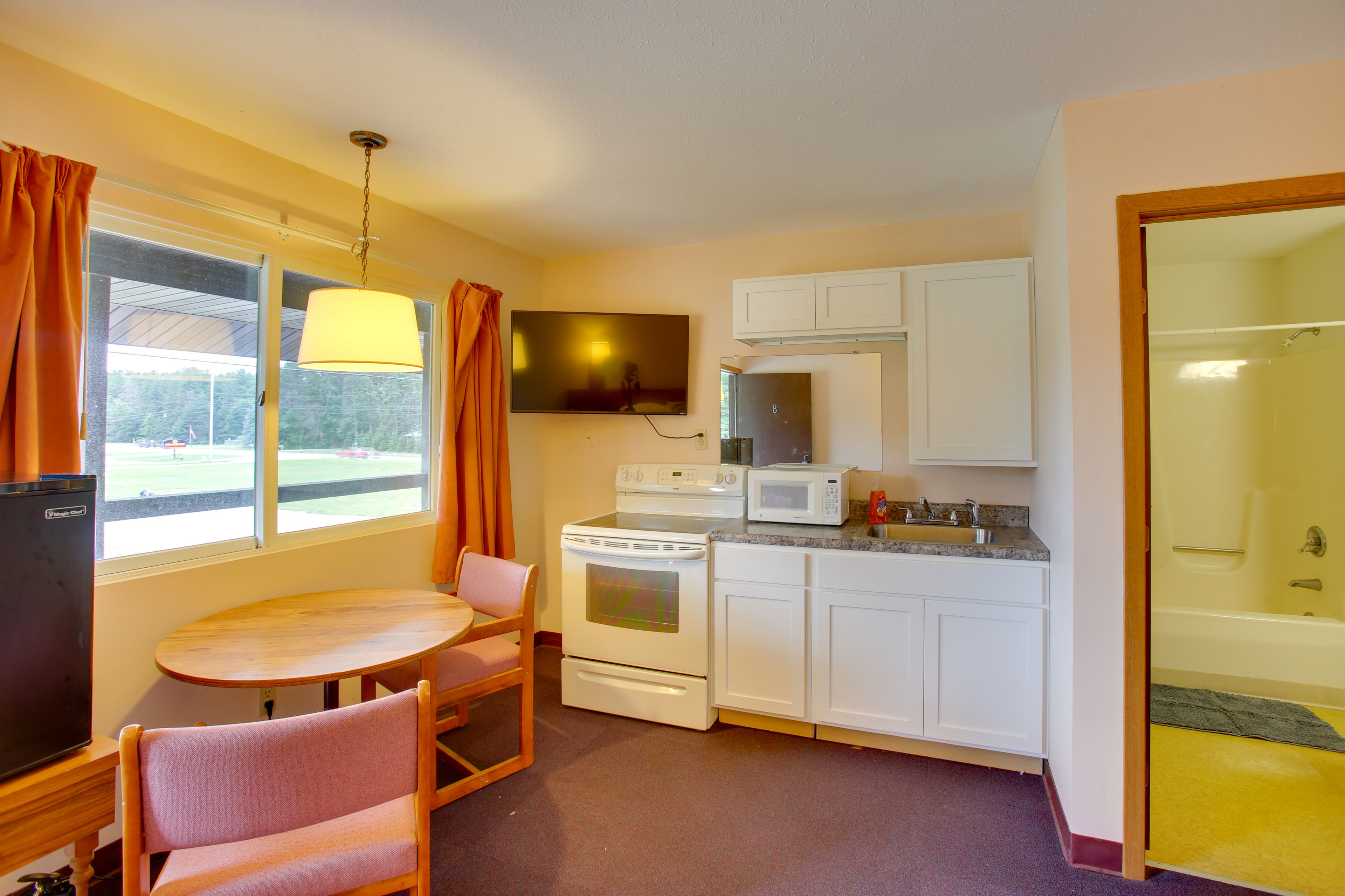 Kitchen | Dining Area | TV | Single-Story Unit