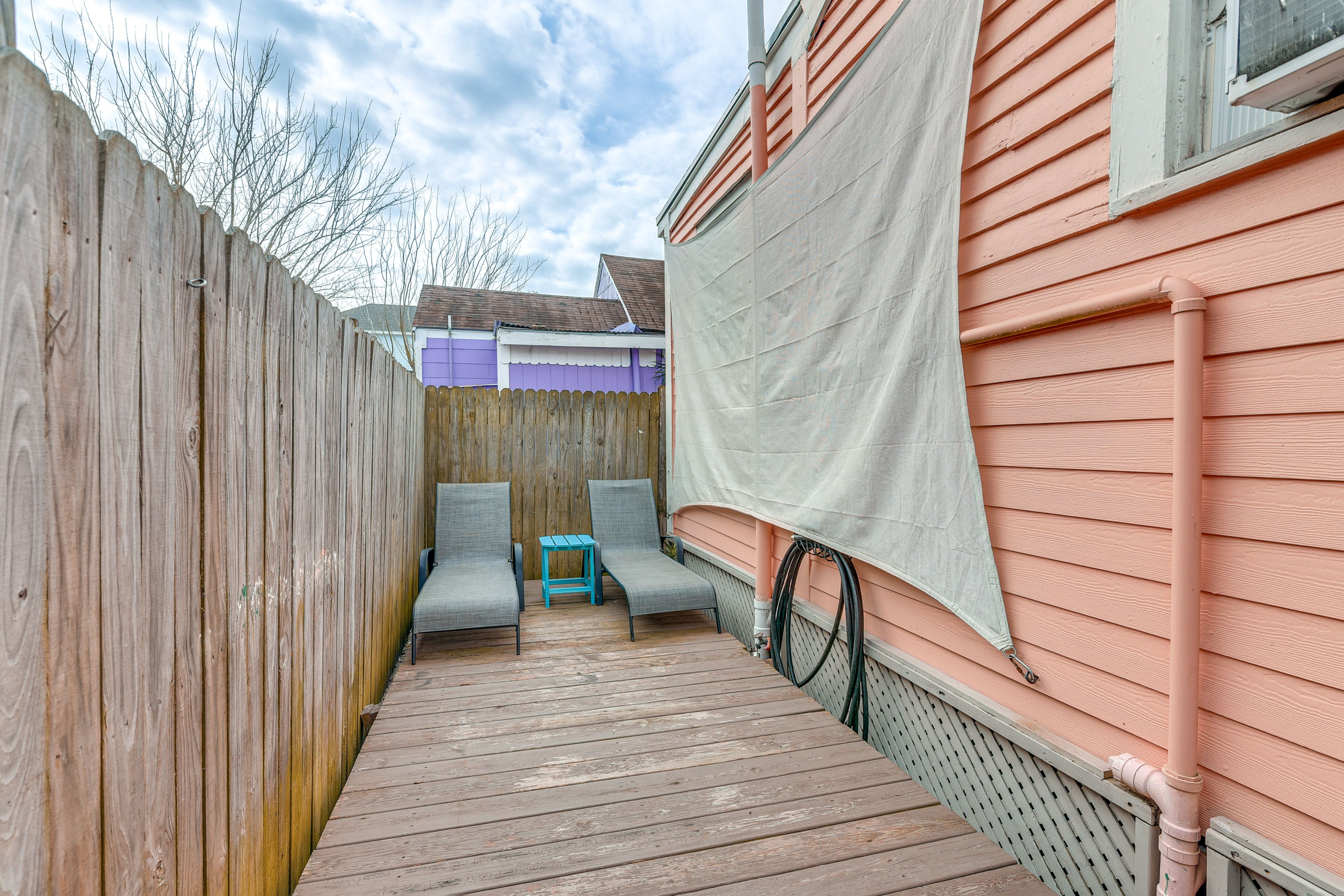 Fenced-In Patio | Lounge Chairs | Sunshade | Fans