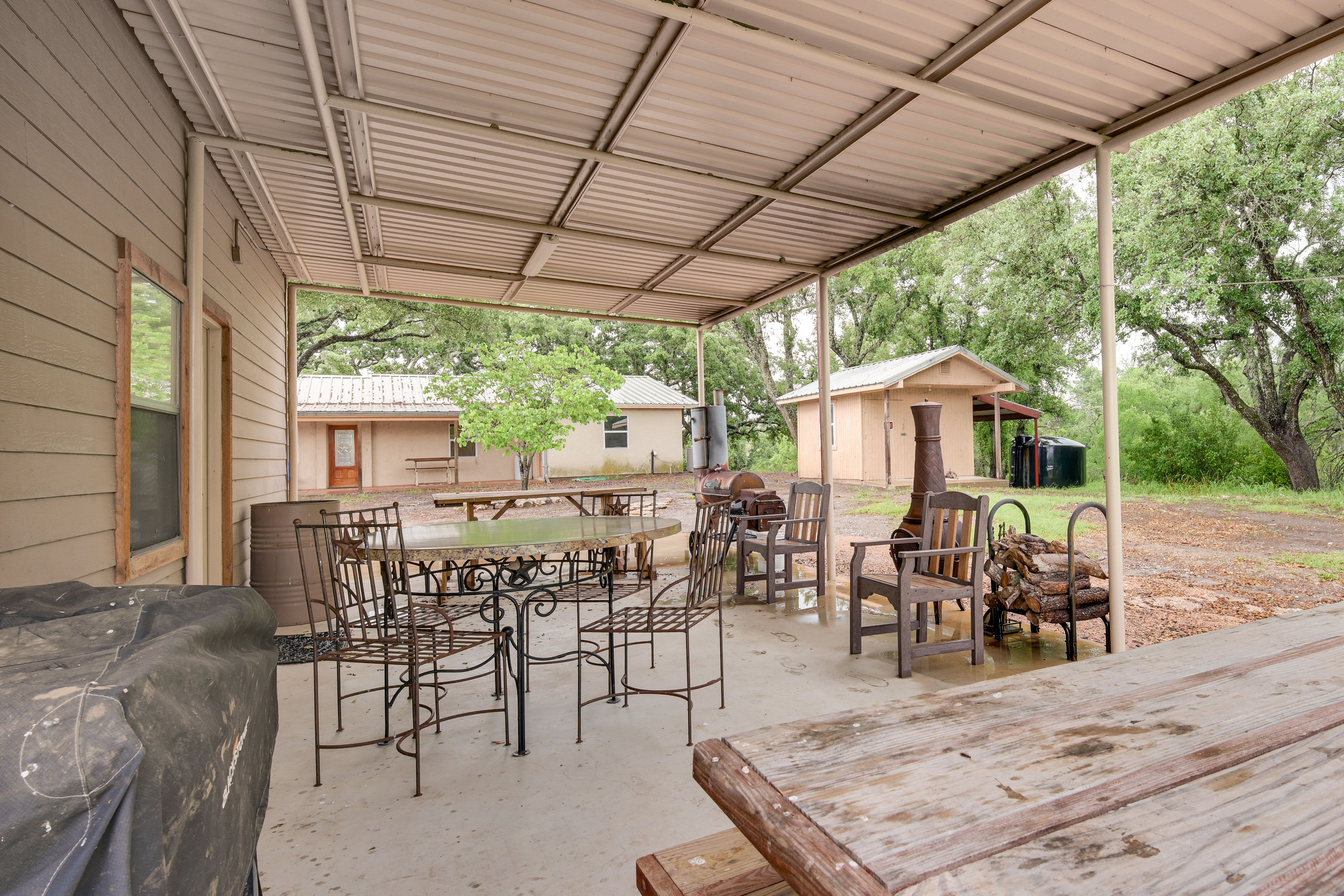 Dorm Exterior | Covered Patio w/ Ample Dining Space | Charcoal Grill