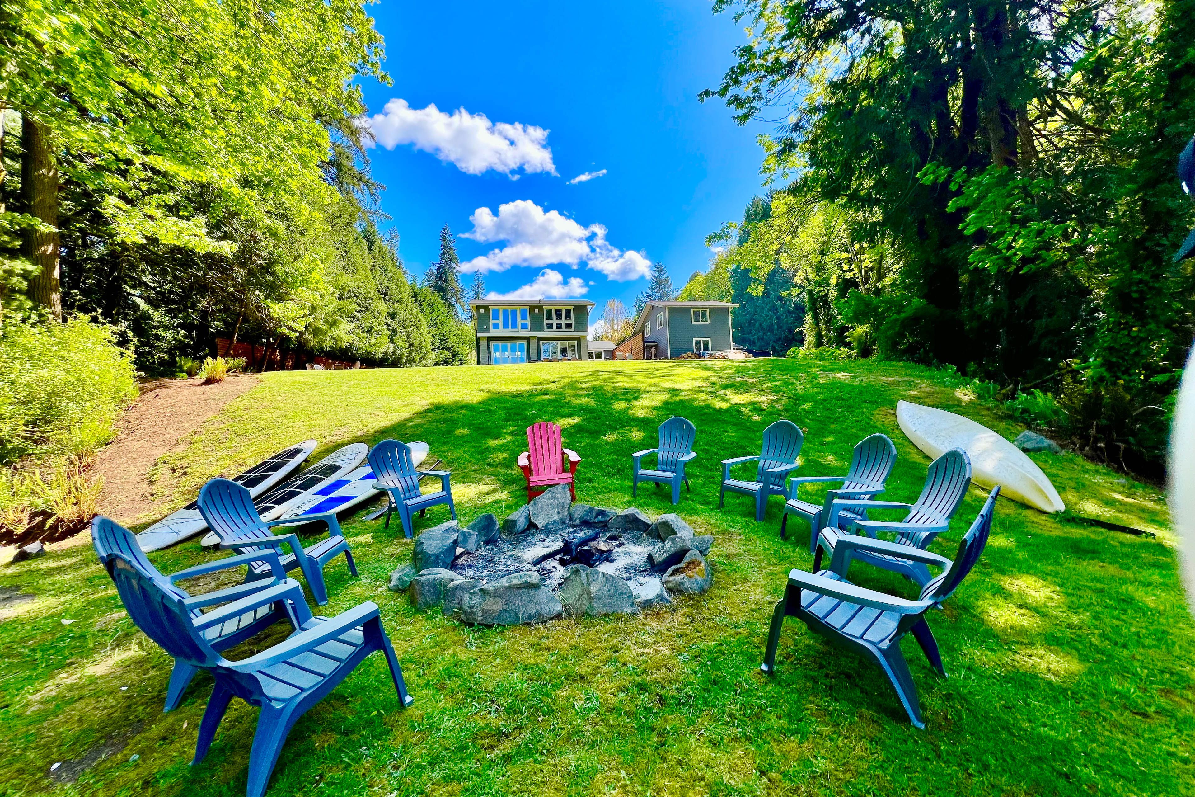 Wood-Burning Fire Pit Area | Outdoor Seating | Metal Rack