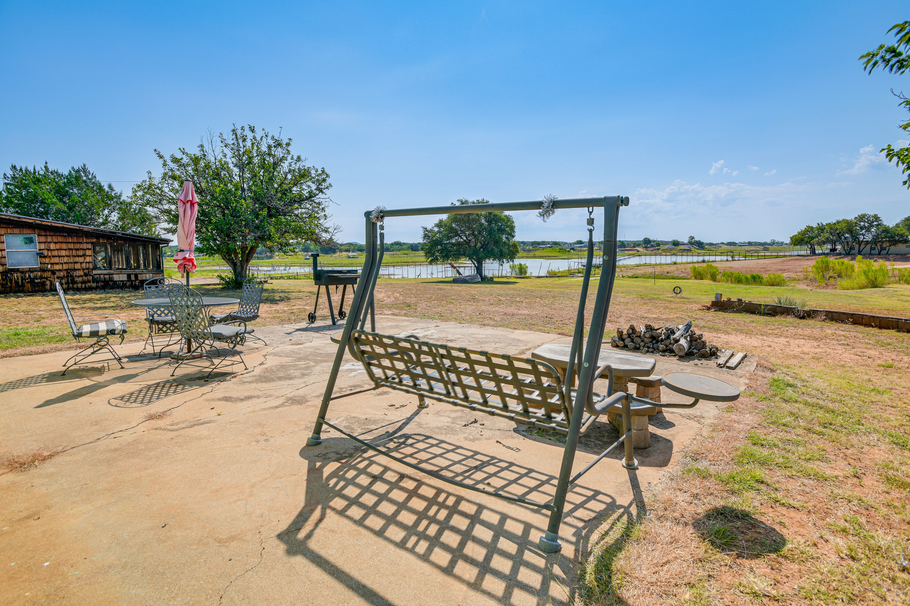 Cottage Exterior | Furnished Patio | Dining Area | Charcoal Grill | Fire Pit